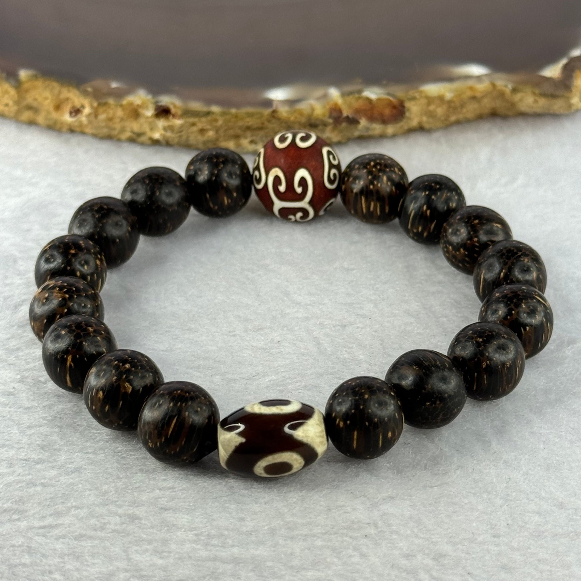 Natural Agarwood With 3 Eyes Dzi Bead Tian Zhu Beads Bracelet 天然沉香带三眼天珠手链 17.70g 16.5cm Dzi 14.4 by 10.1 and 14.0mm 1 Bead and 10.8mm 16 Beads - Huangs Jadeite and Jewelry Pte Ltd