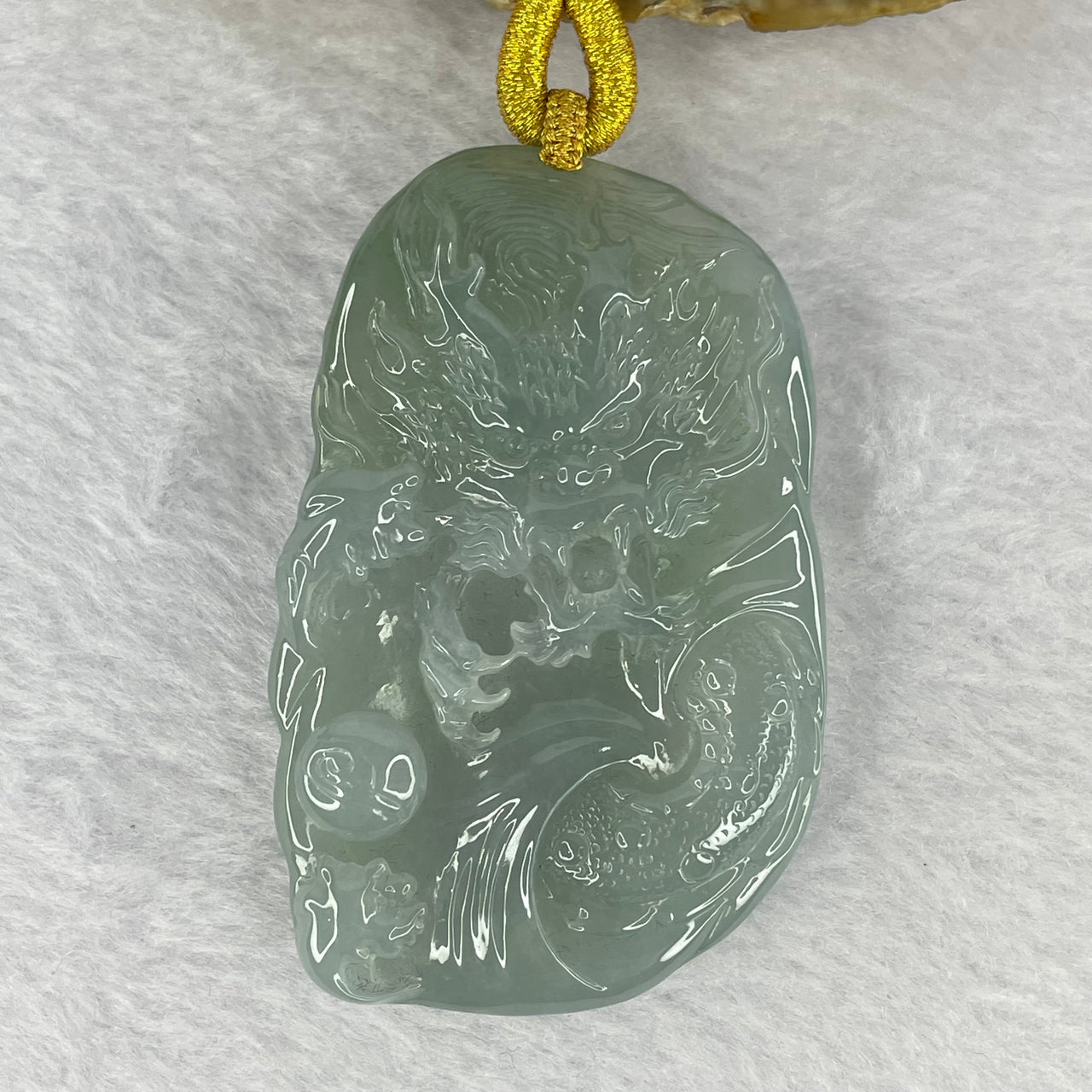 Rare Type A Semi Icy Translucent Sky Blue (Faint Blueish Green) Jadeite Dragon Pendant including Necklace 罕见A货冰糯总天空蓝翡翠龙牌 65.11g 65.67 by 41.90 by 12.10mm with NGI Cert No. 82823873 - Huangs Jadeite and Jewelry Pte Ltd