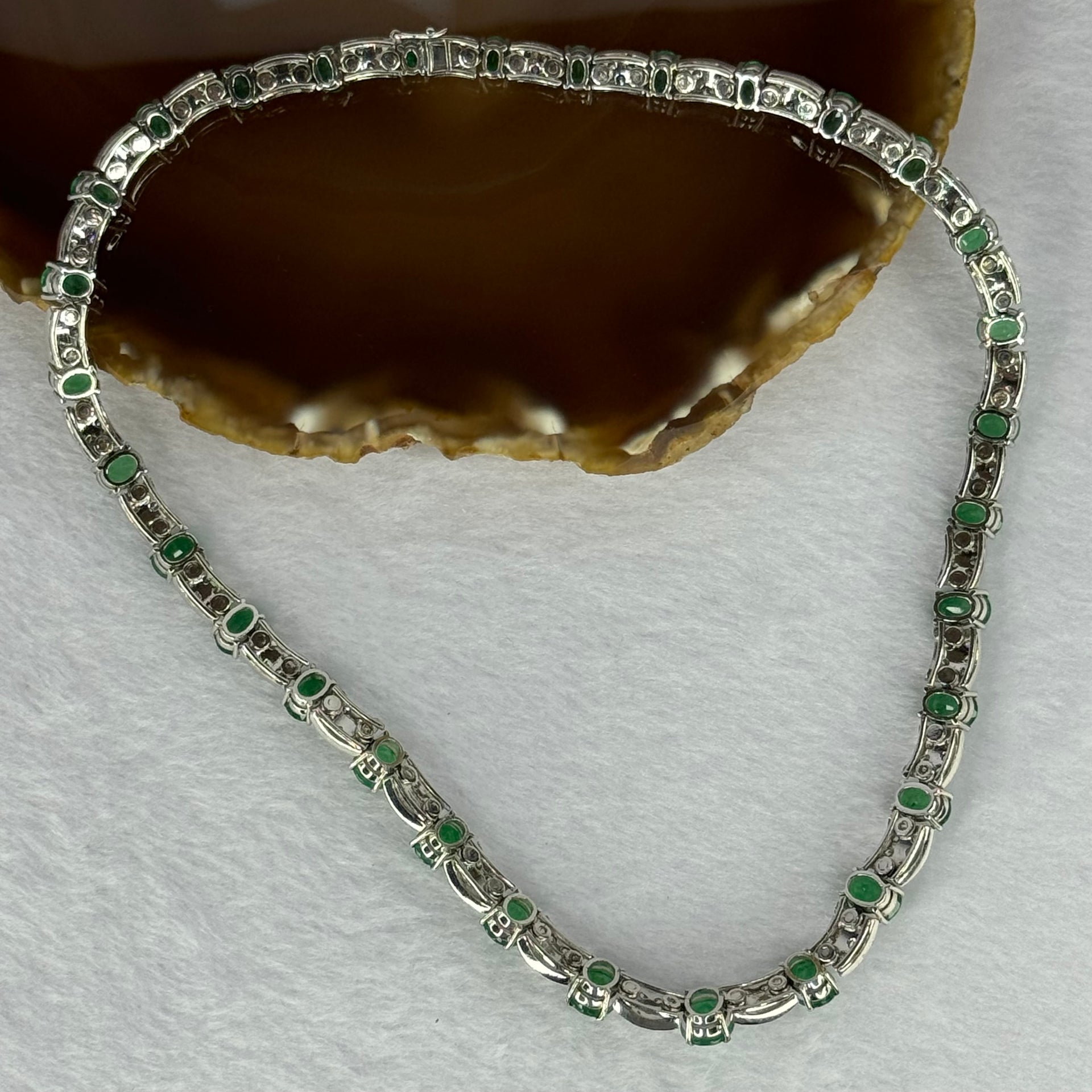 Natural Emeralds (Beryl) 25.0 cts. Total 42.34g including 31 Emeralds, 121 Natural Diamonds in 8k White Gold with NGI Cert No. 82835786 - Huangs Jadeite and Jewelry Pte Ltd