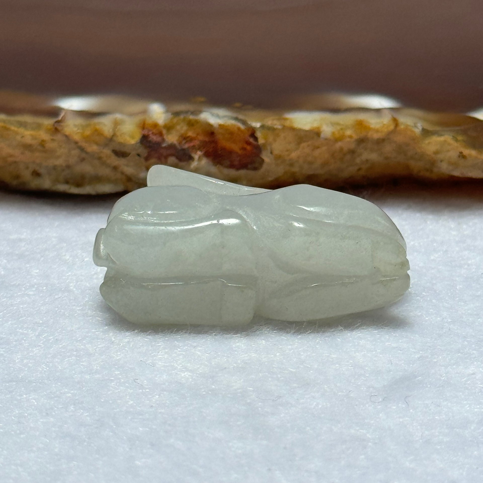 Type A Light Lavender Green Jadeite Rabbit Pendant 13.12g 31.6 by 12.8 by 17.8mm - Huangs Jadeite and Jewelry Pte Ltd