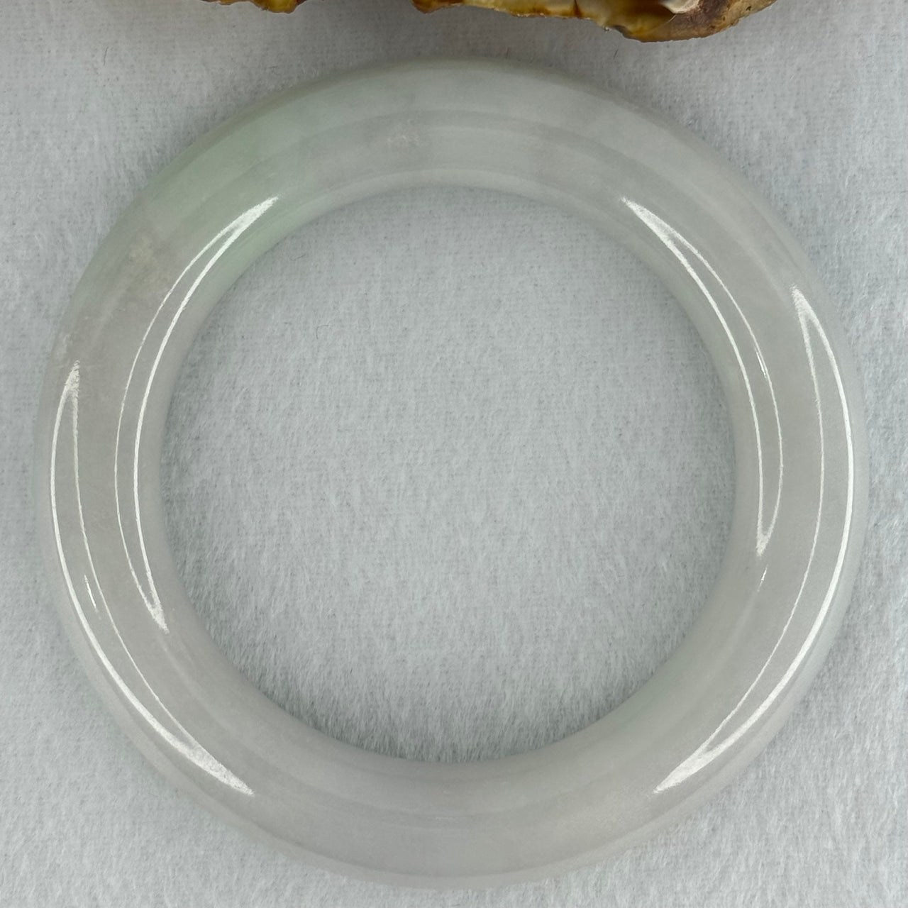 Type A Translucent Faint Blueish Green with Faint Lavender Jadeite Bangle Internal Diameter 56.79mm 437.29cts 87.85g 12.0 by 13.0mm With NGI Cert 32886087 (Close to Perfect)