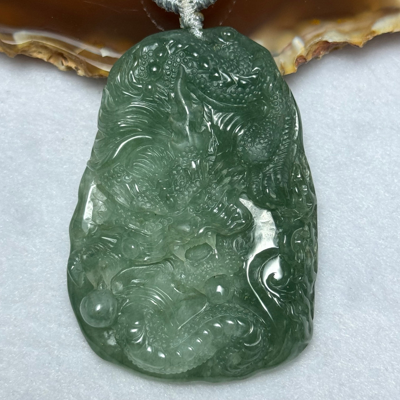 Type A Semi Icy Intense Green Jadeite Dragon Pendent 57.55g 63.1 by 44.4 by 11.3mm - Huangs Jadeite and Jewelry Pte Ltd