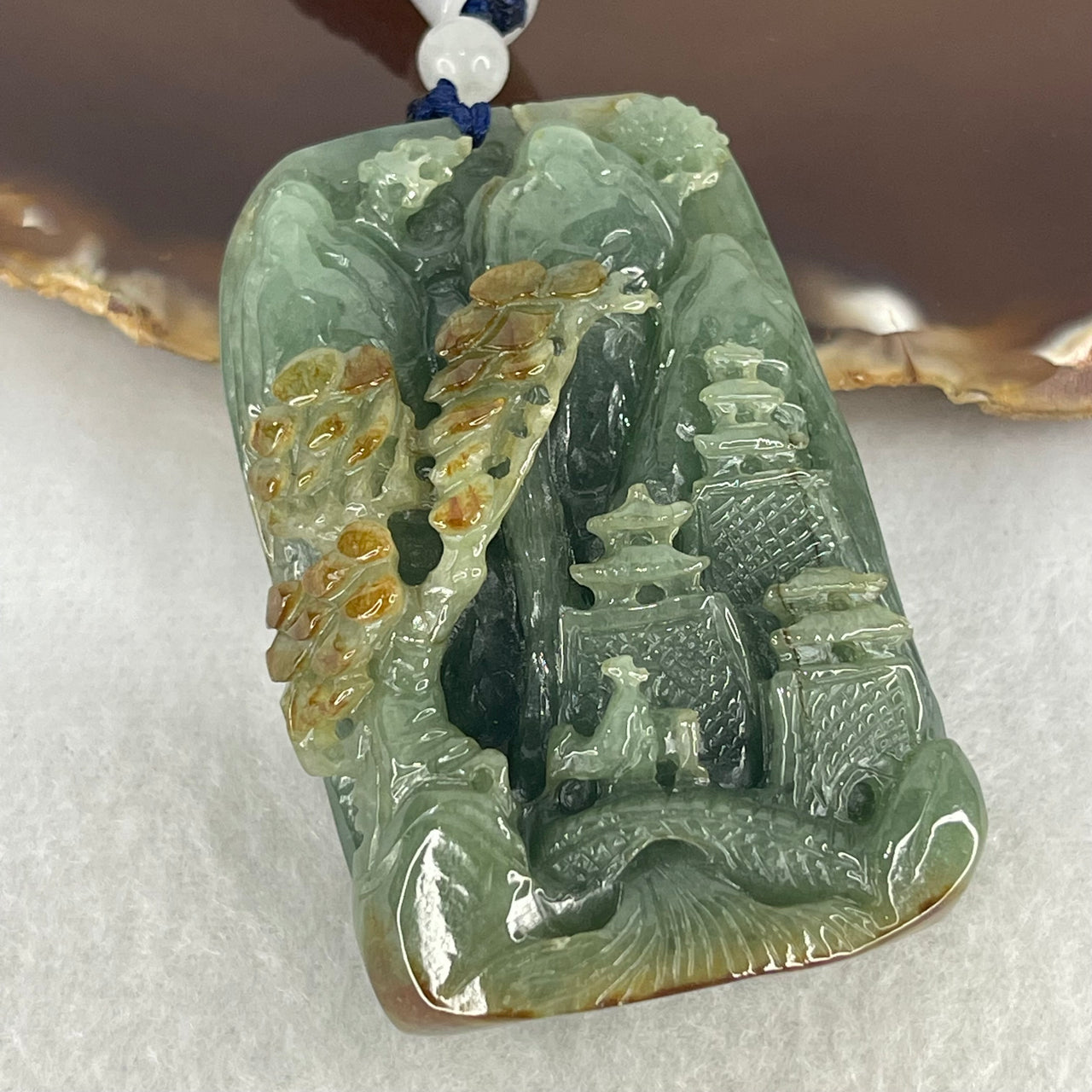 Type A Dark Blueish Green with Brown Patches Jadeite Double Sided Shan Shui with Gui Ren Benefactor Pendant 84.62g 58.0 by 39.1 by 19.4mm