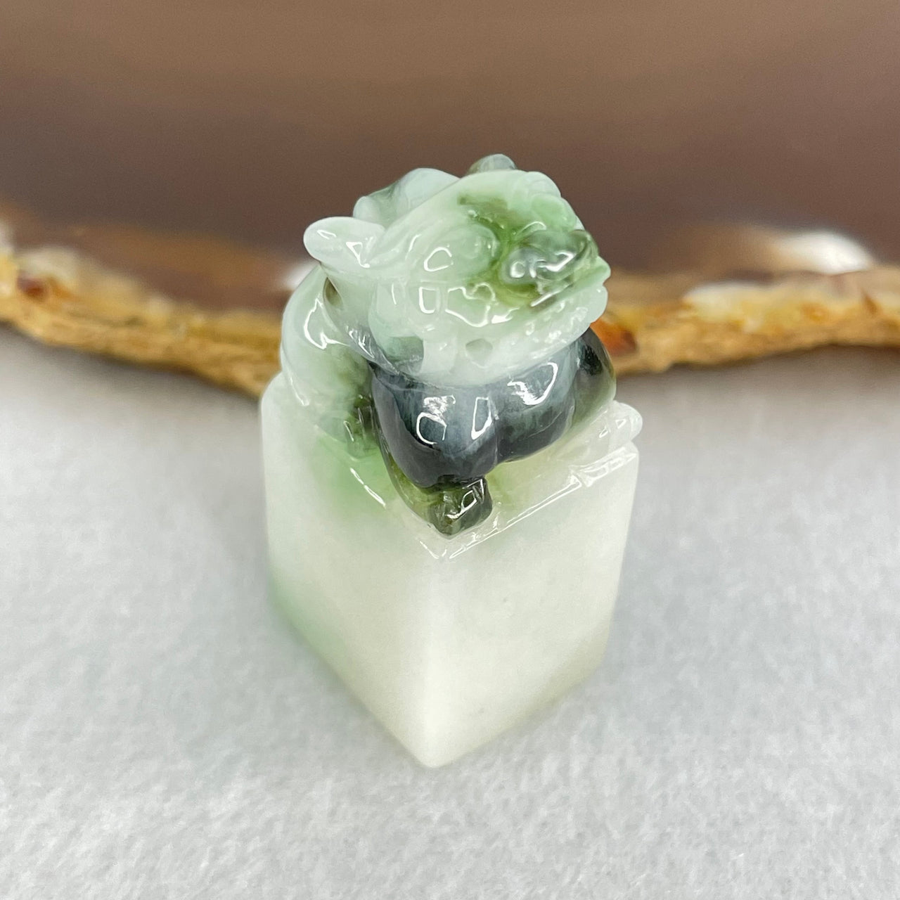 Type A Faint Green Lavender with Dark Blueish Green Piao Hua Jadeite Pixiu Seal Display 20.70g 34.9 by 17.1 by 13.7mm