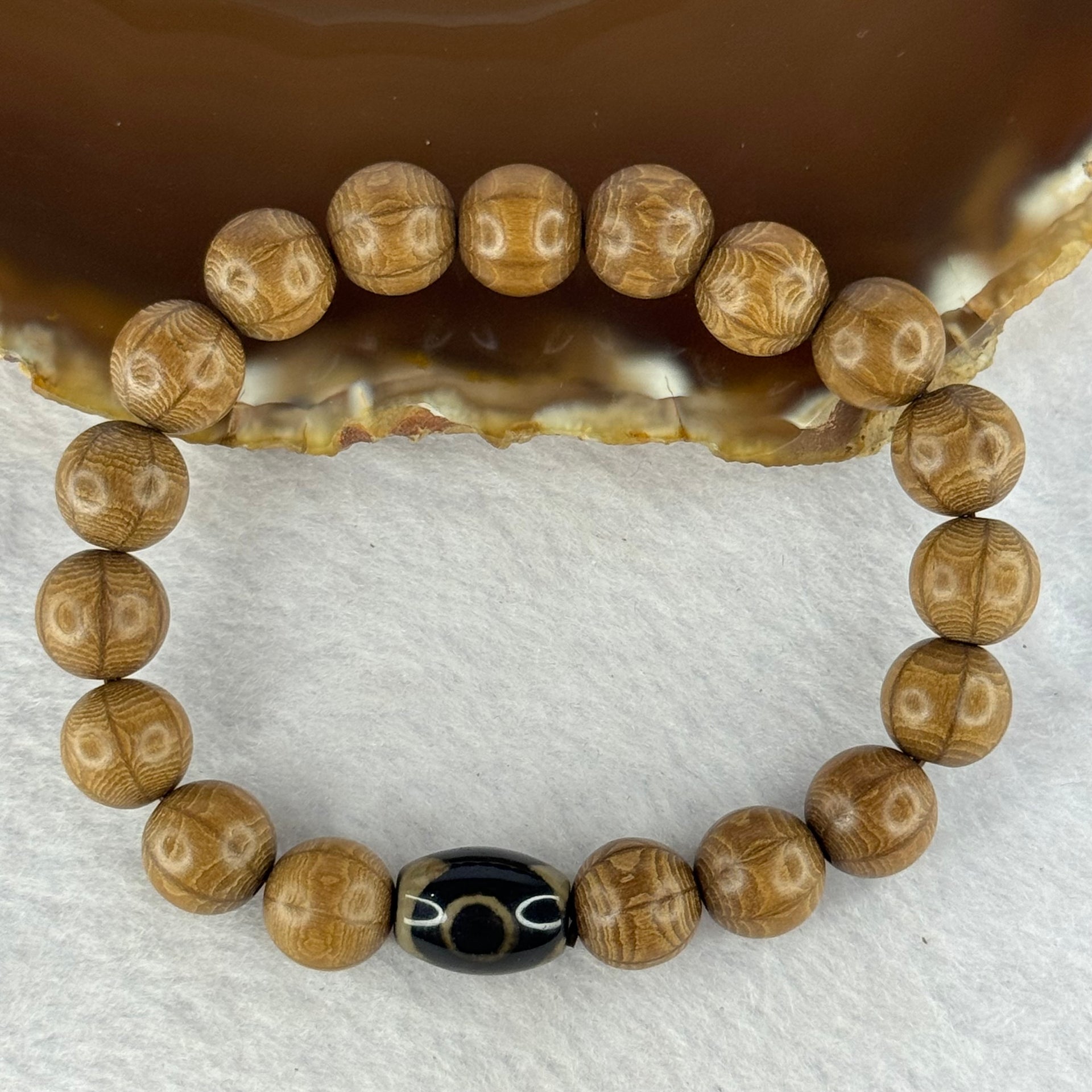 Natural Six Way Wooden Bead With 3 Eyes Dzi Bead Tian Zhu Beads Bracelets 天然六道木带三眼天珠手链 11.37g 16.5cm 10.4mm 18 Beads/ 13.5 by 10.1mm 1 Bead - Huangs Jadeite and Jewelry Pte Ltd