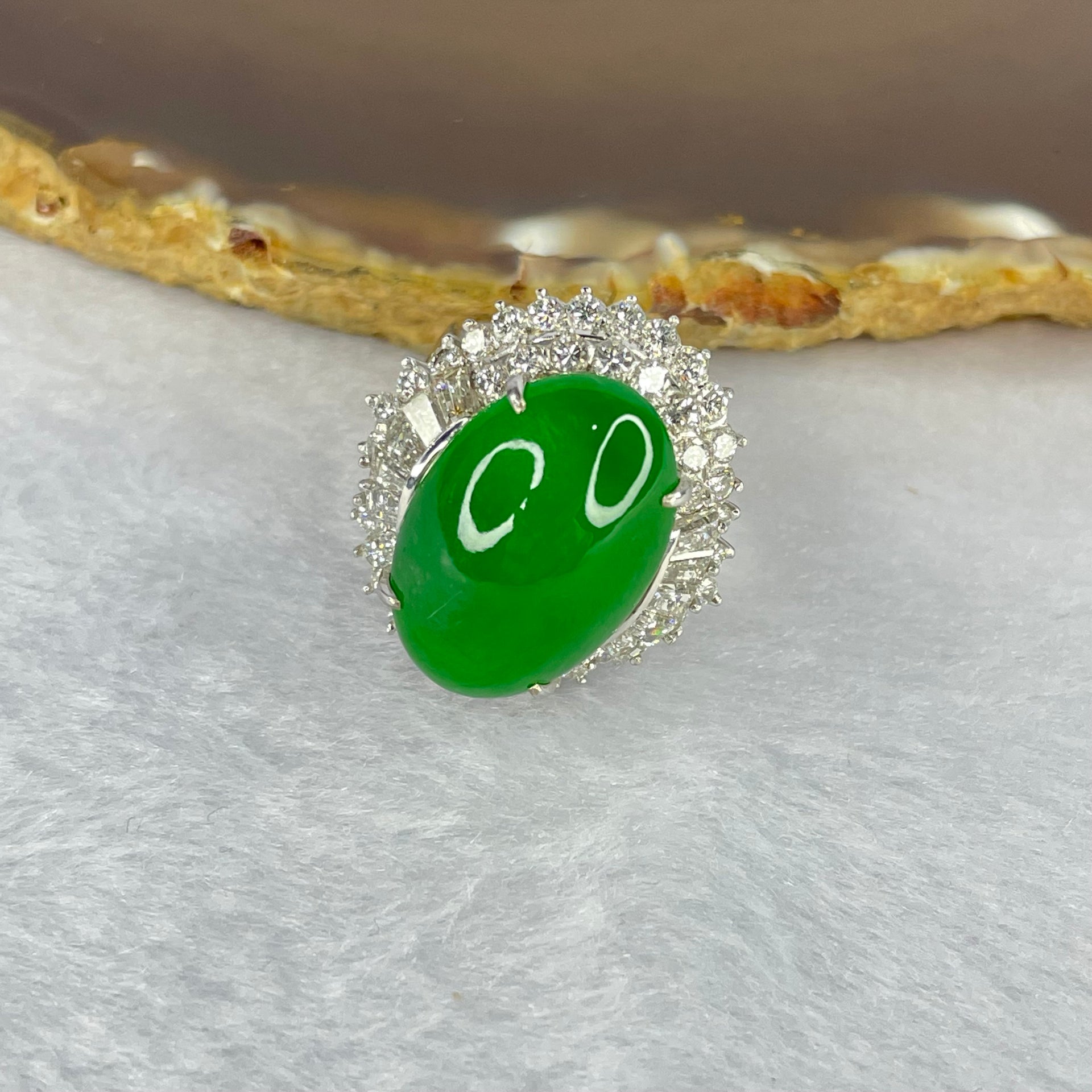 Very Very High Quality Highly Translucent Natural Intense Green Jadeite (TYPE A) Oval Cabochon Approx. 20.93 by 13.95 by 6.58mm Total Weight 13.60g including Natural Diamonds and 13K White Gold Ring Setting with NGI Cert No.82835781 - Huangs Jadeite and Jewelry Pte Ltd