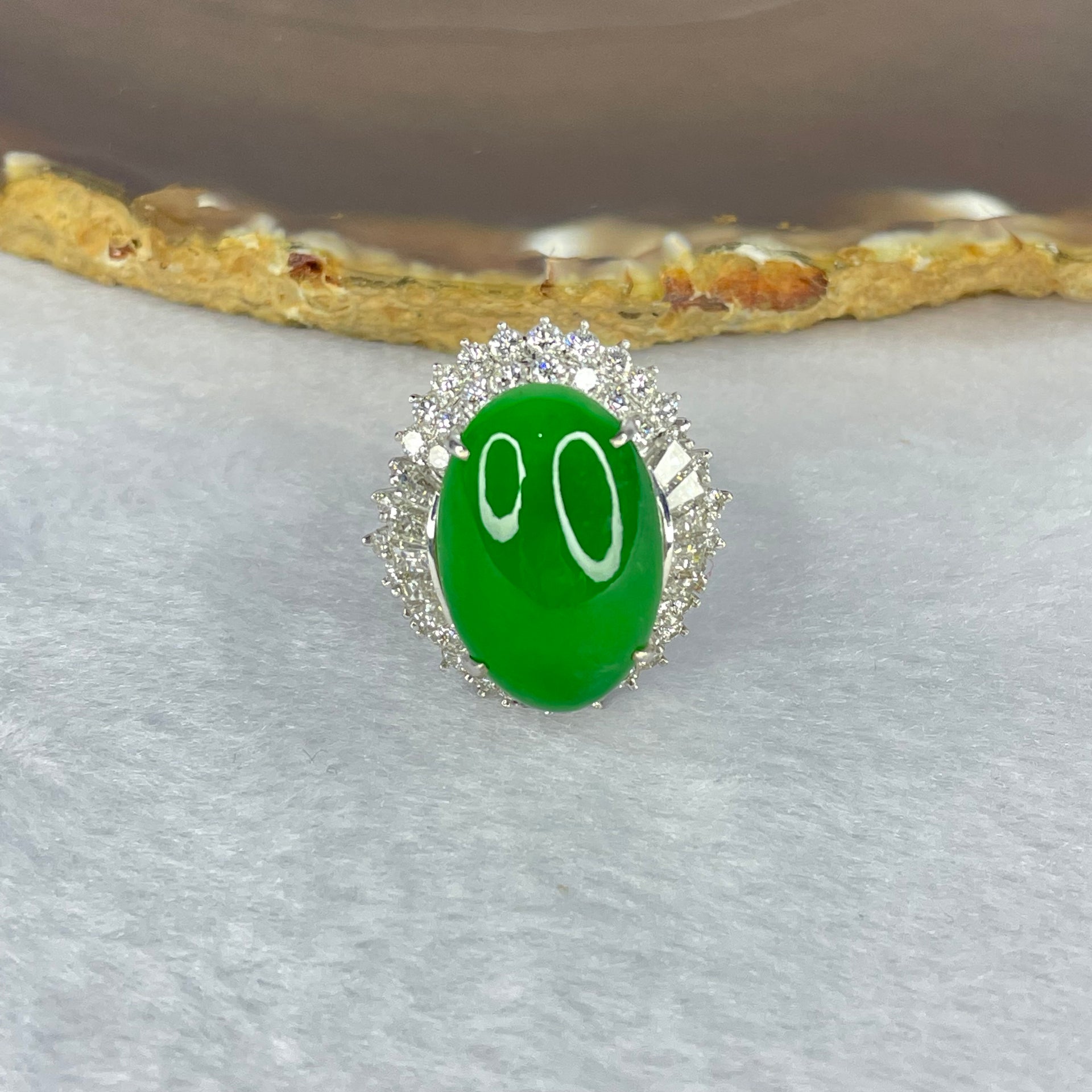 Very Very High Quality Highly Translucent Natural Intense Green Jadeite (TYPE A) Oval Cabochon Approx. 20.93 by 13.95 by 6.58mm Total Weight 13.60g including Natural Diamonds and 13K White Gold Ring Setting with NGI Cert No.82835781 - Huangs Jadeite and Jewelry Pte Ltd