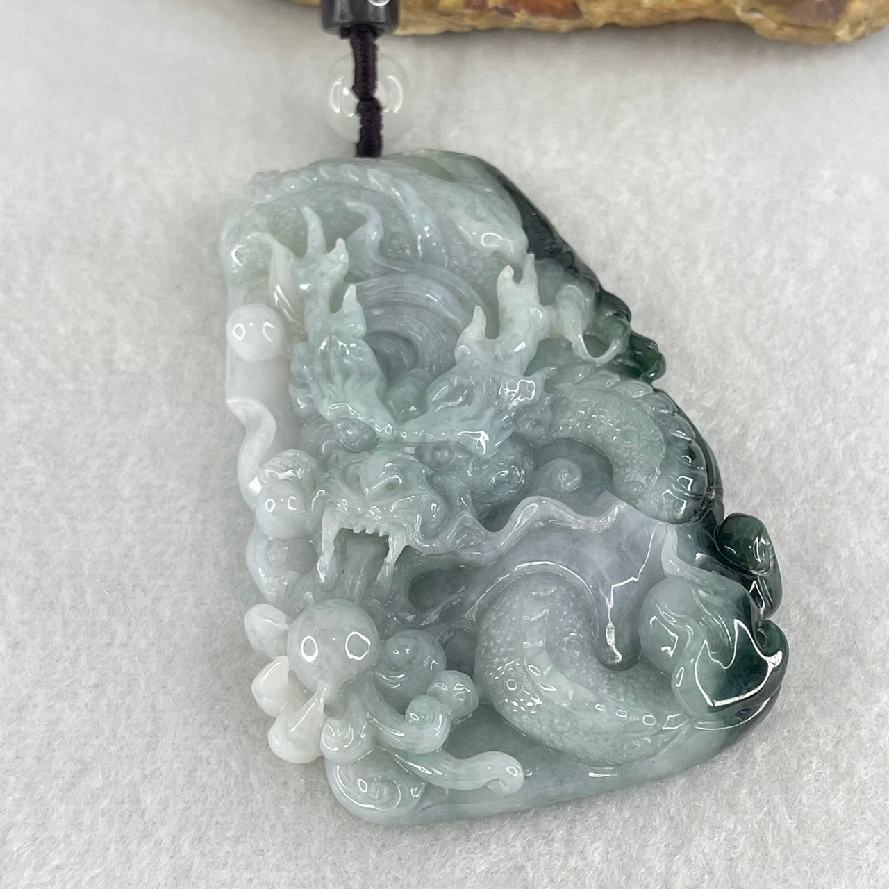 Type A Light Green and Light Lavender with Dark Blueish Green Patch Jadeite Double Sided Dragon Pendant 83.46g 74.4 by 48.5 by 13.3mm