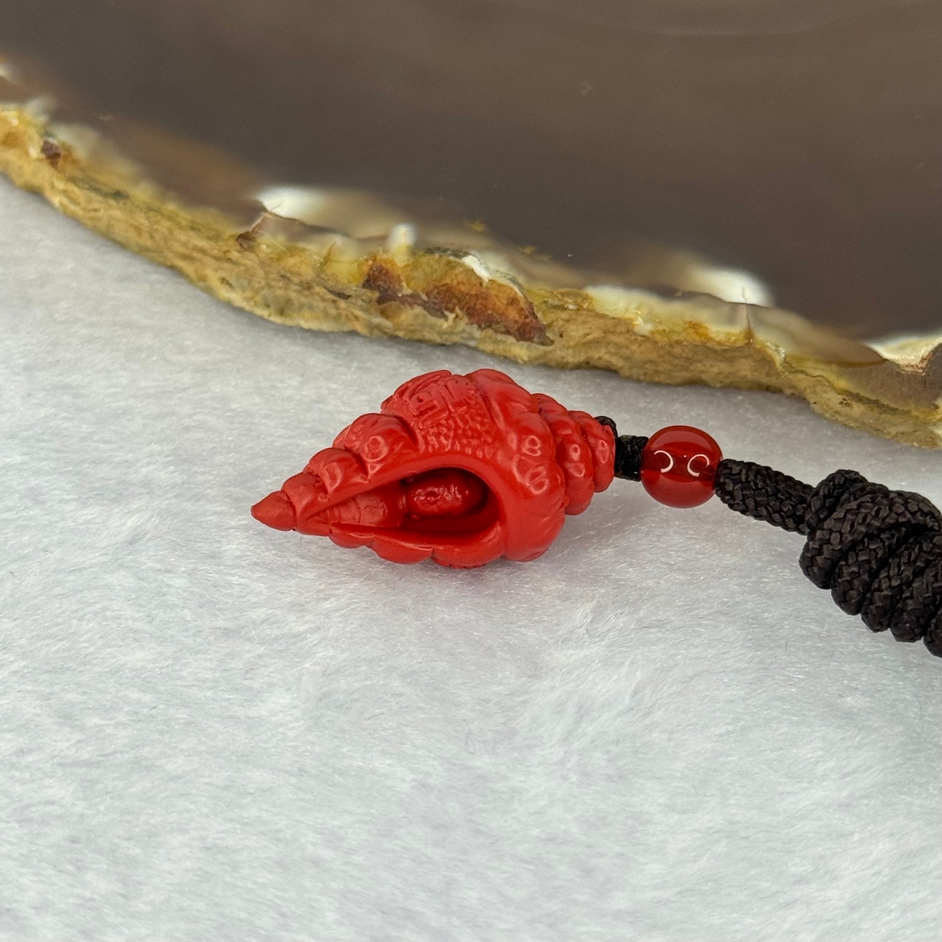 Natural Red Cinnabar Snail Shell with Buddha 7.55g 25.6 by 14.4 by 13.5mm - Huangs Jadeite and Jewelry Pte Ltd