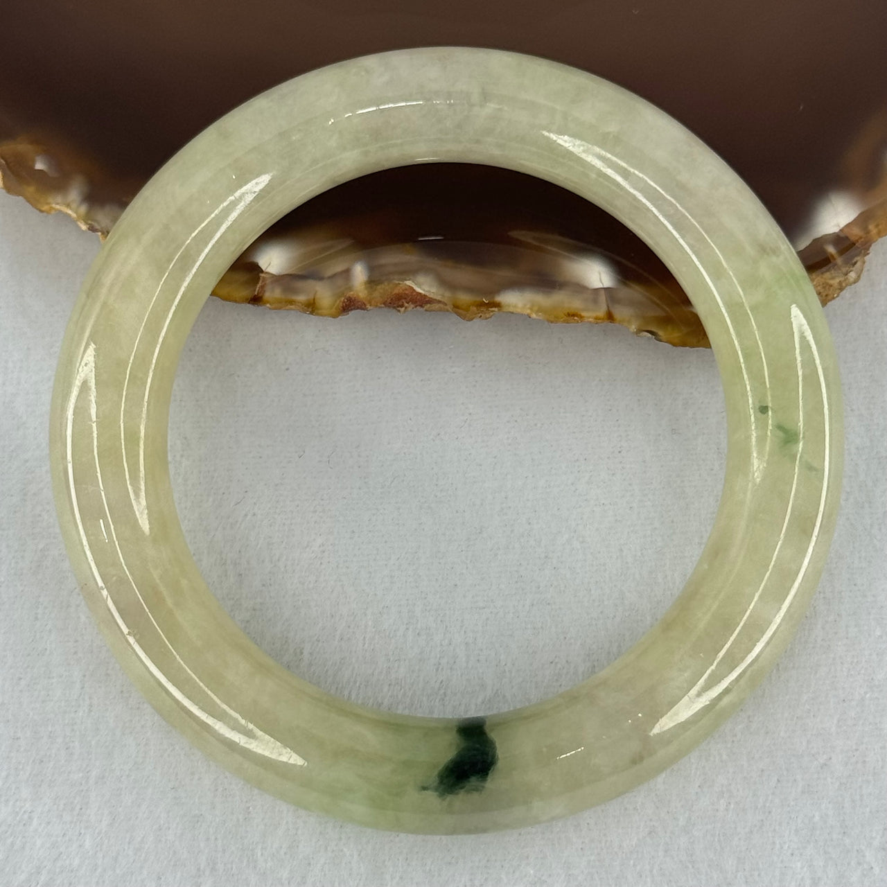 Type A Translucent Semi Icy Light Yellowish Green with Moss Green Patch Jadeite Bangle Internal Diameter 55.3mm 76.40g 12.3 by 11.6mm (Very Slight External Rough)