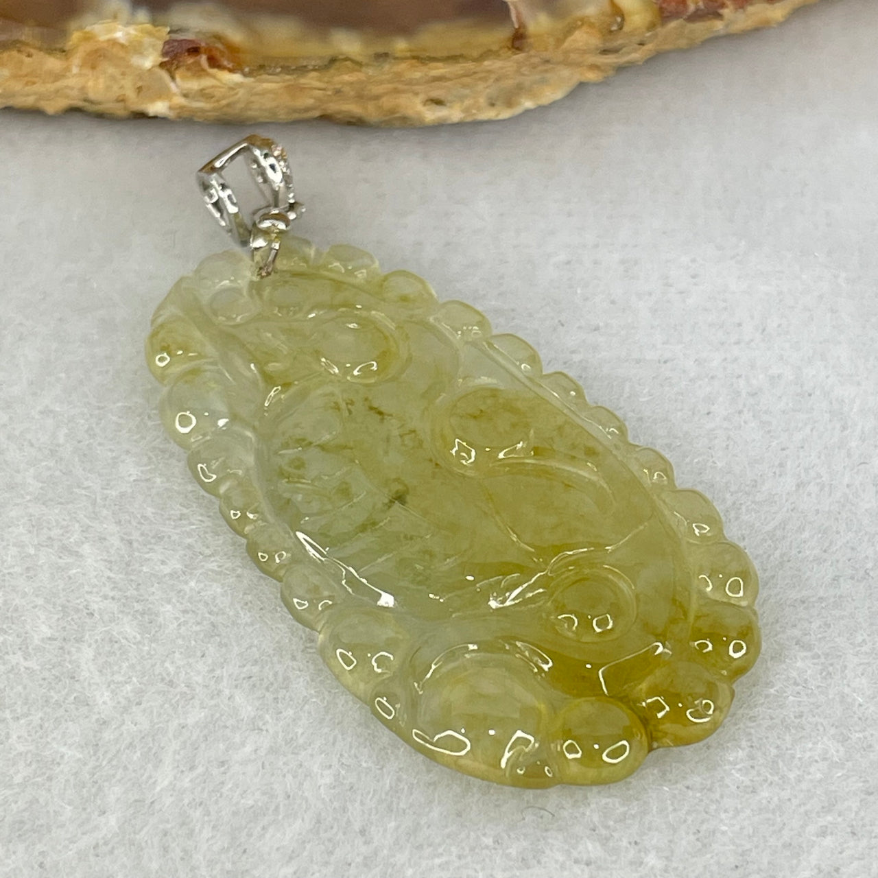 Type A High Icy Yellow to Colourless Jadeite Dragon Pendant 5.26g 39.2 by 21.4 by 3.3mm