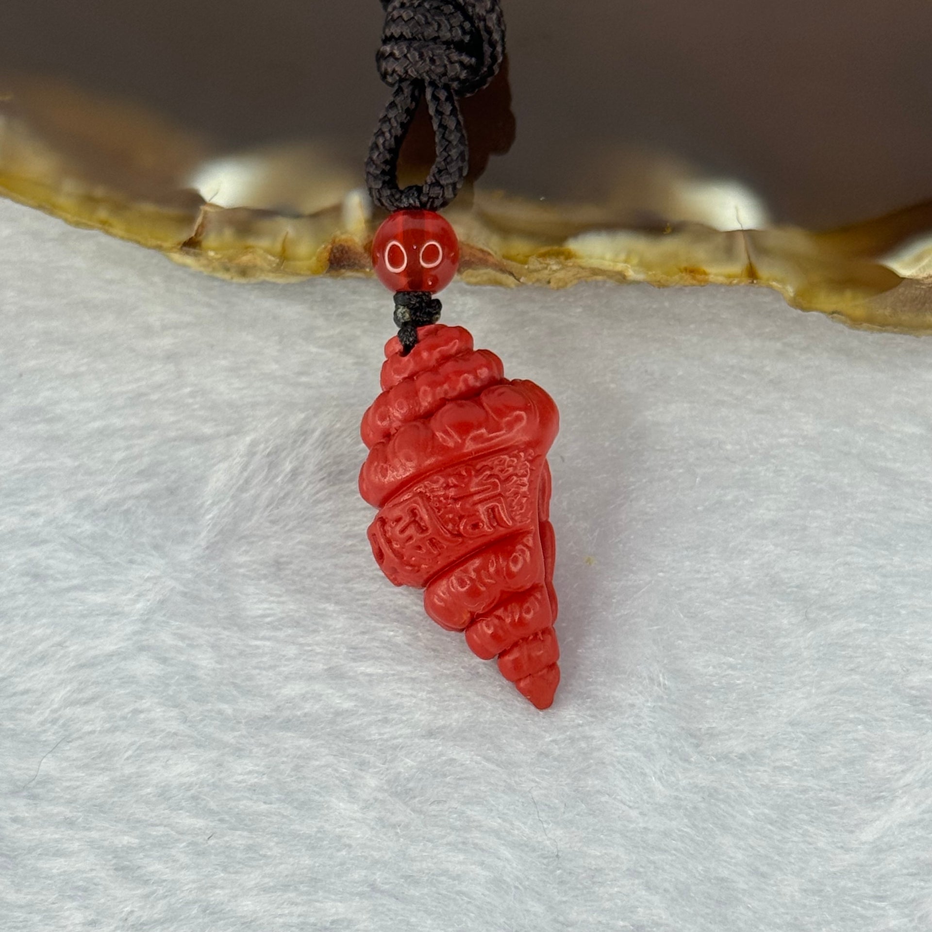 Natural Red Cinnabar Snail Shell with Buddha 7.55g 25.6 by 14.4 by 13.5mm - Huangs Jadeite and Jewelry Pte Ltd