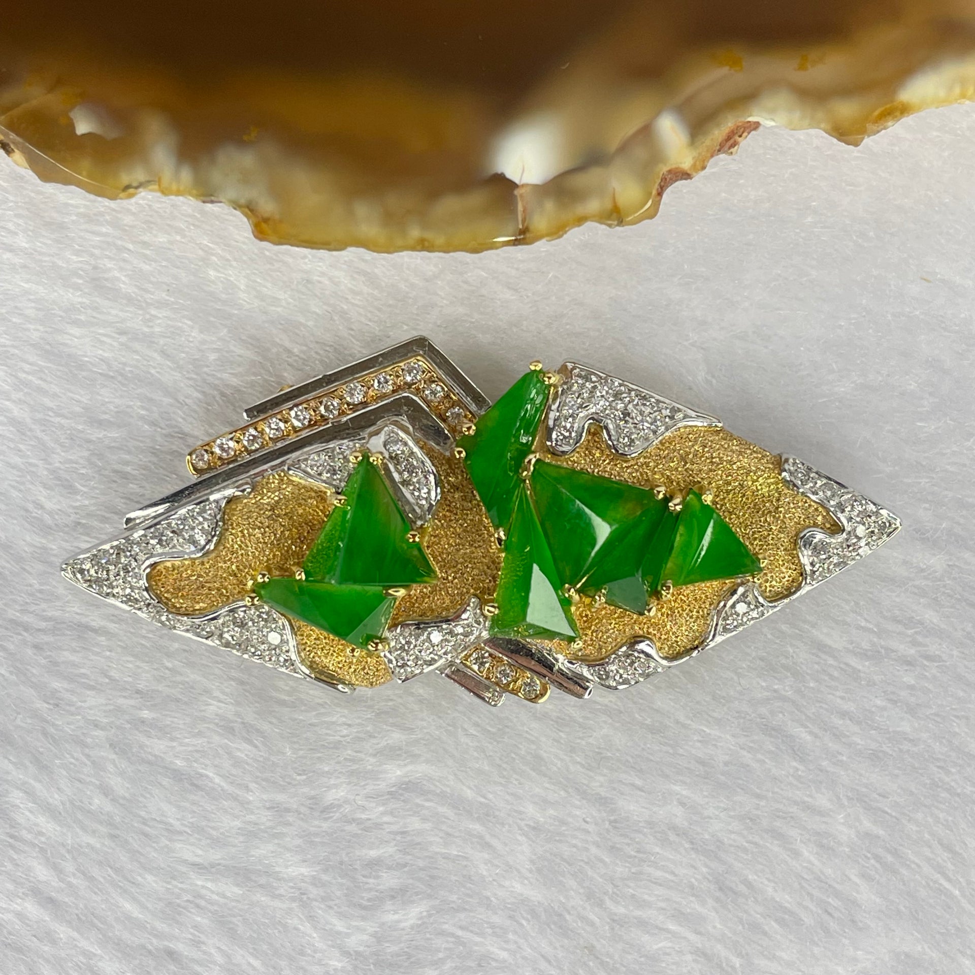 Very Very High Quality Highly Translucent Natural Emerald Green Jadeite (TYPE A) Brooch Approx. 6.5 by 5.50 by 2.82 to 7.97 by 8.30 by 4.63mm Total Weight 17.71g including Natural Diamonds and 18K Yellow Gold and PT900 Setting with NGI Cert No.82835782 - Huangs Jadeite and Jewelry Pte Ltd