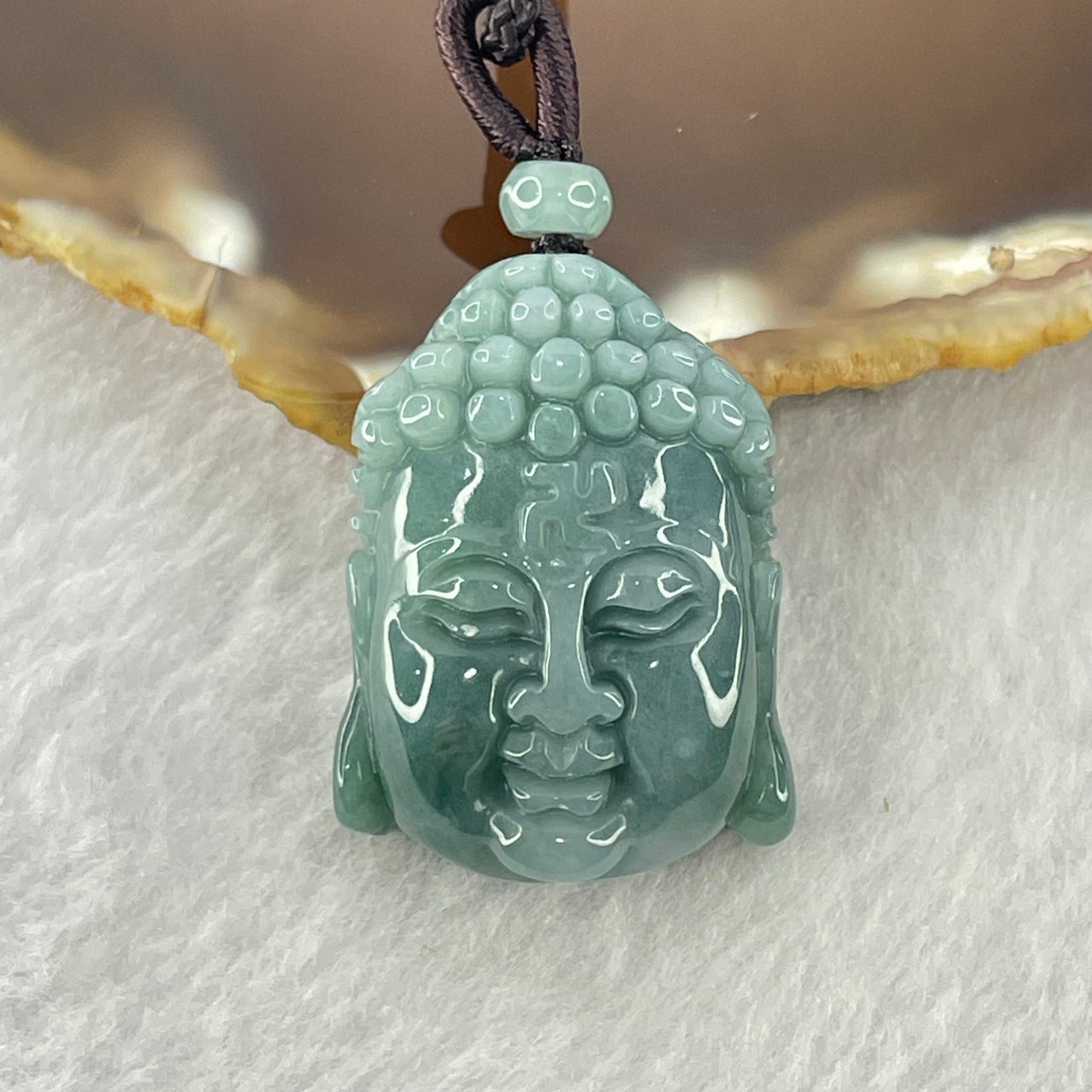 Type A Blueish Green Jadeite Buddha Head Pendant 20.25g 29.9 by 21.9 by 13.1mm