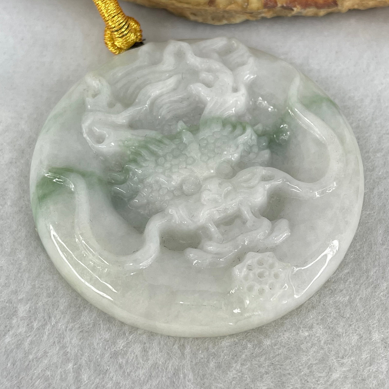 Type A Faint Lavender Green with Blueish Green Stripe Jadeite Round Dragon Pendant 45.44g 52.4 by 7.9mm