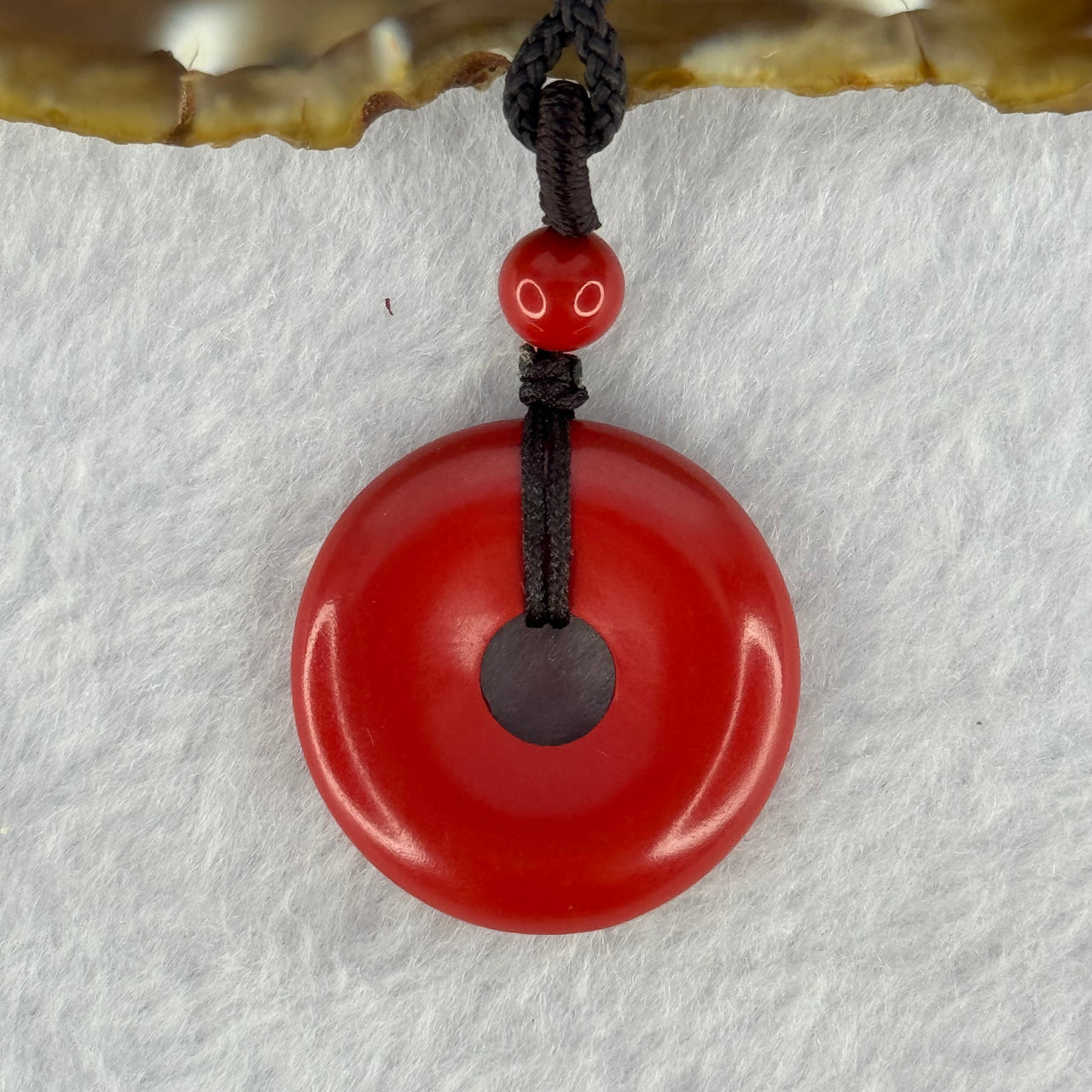 Natural Red Cinnabar Ping An Kou Donut Pendent 11.04g 25.4 by 6.5mm