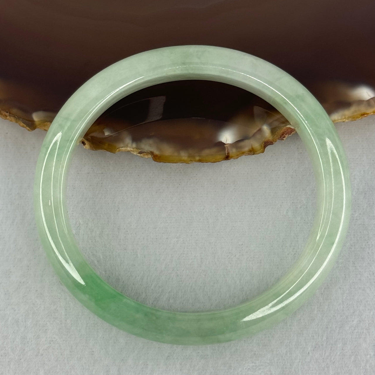 Type A Semi Icy Bright Green Jadeite Oval Bangle Internal Diameter 54.4mm 40.37g 11.3 by 8.4mm (Slight Internal Lines)