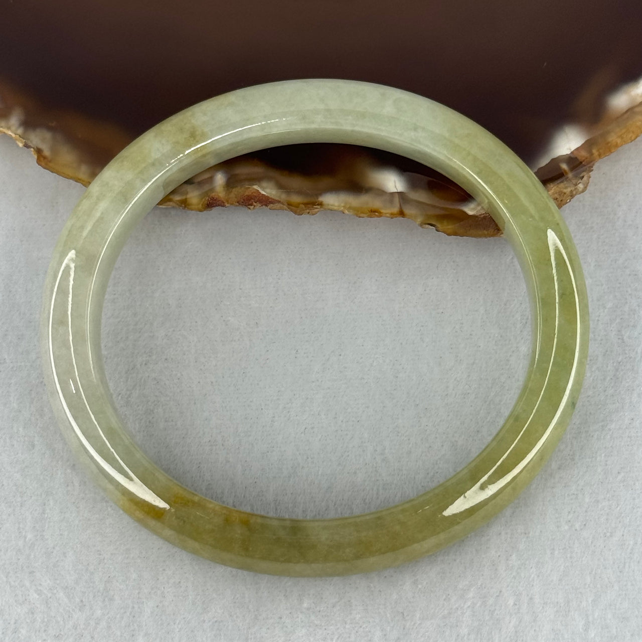 Type A Yellowish Green Lavender Jadeite Oval Bangle Internal Diameter 58.5mm 67.31g 10.7 by 8.1mm (Very Slight Fine Internal Line)