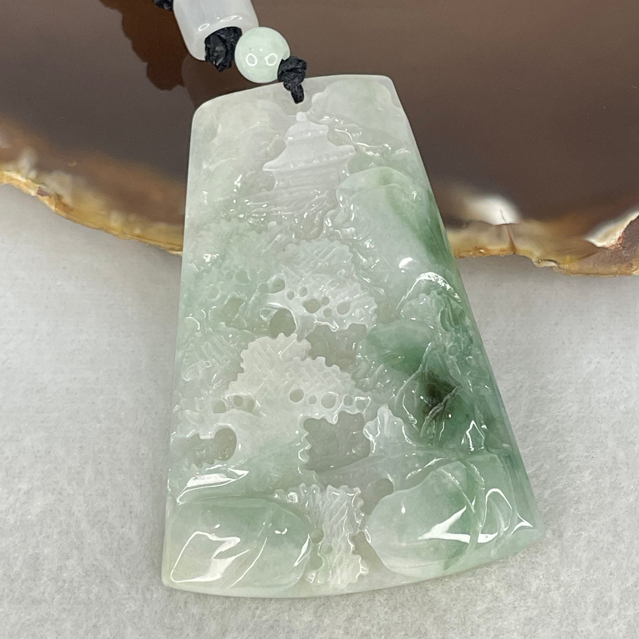 Type A Faint Lavender and Blueish Green Piao Hua Jadeite Shan Shui with Gui Ren Benefactor Pendant 29.99g 57.4 by 41.0 by 7.8mm