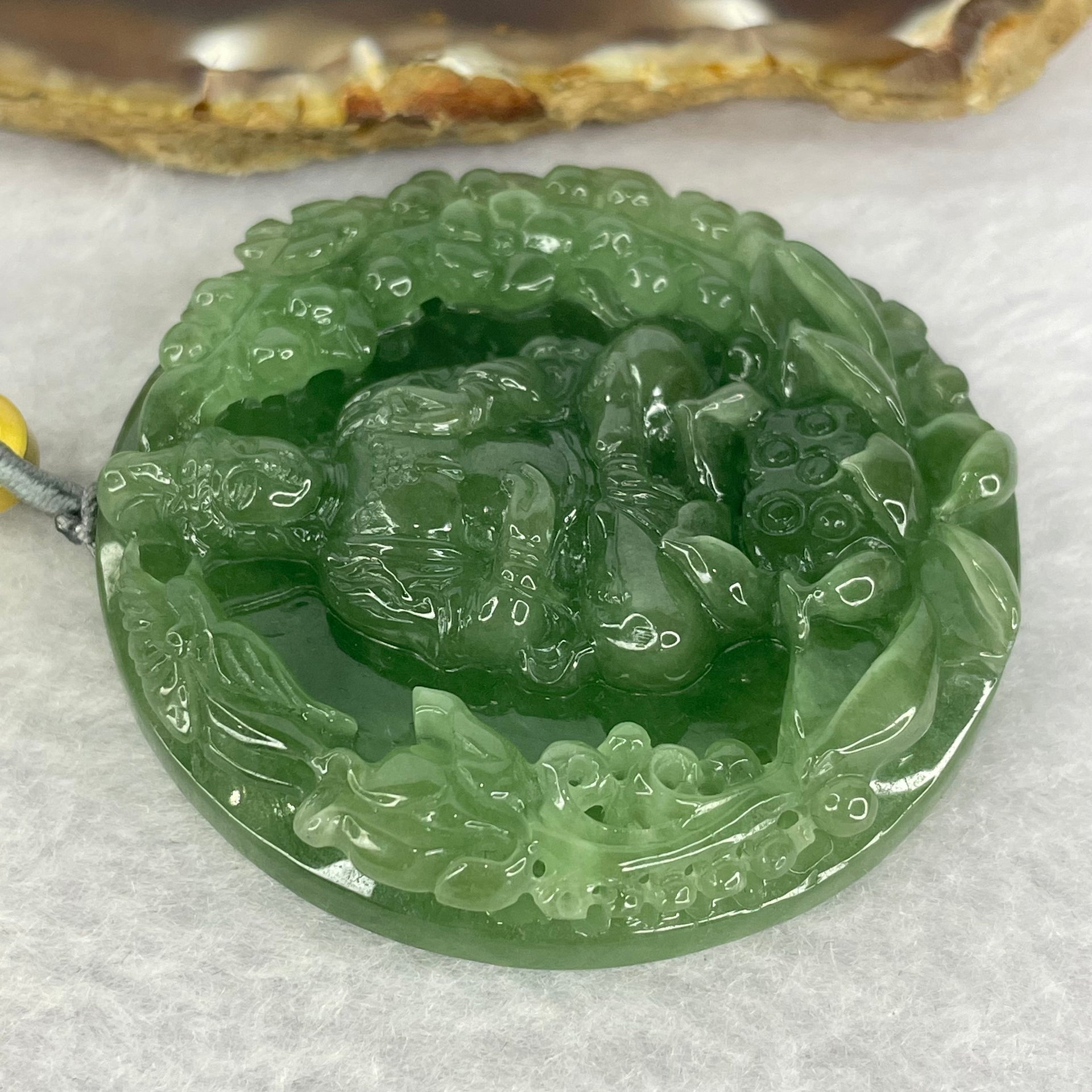 Golden Award Grand Master Type A Semi Icy Intense Green Jadeite Guan Yin on Lotus with Flowers 花开富贵观音 Pendant 62.02g 53.0 by 11.2mm - Huangs Jadeite and Jewelry Pte Ltd