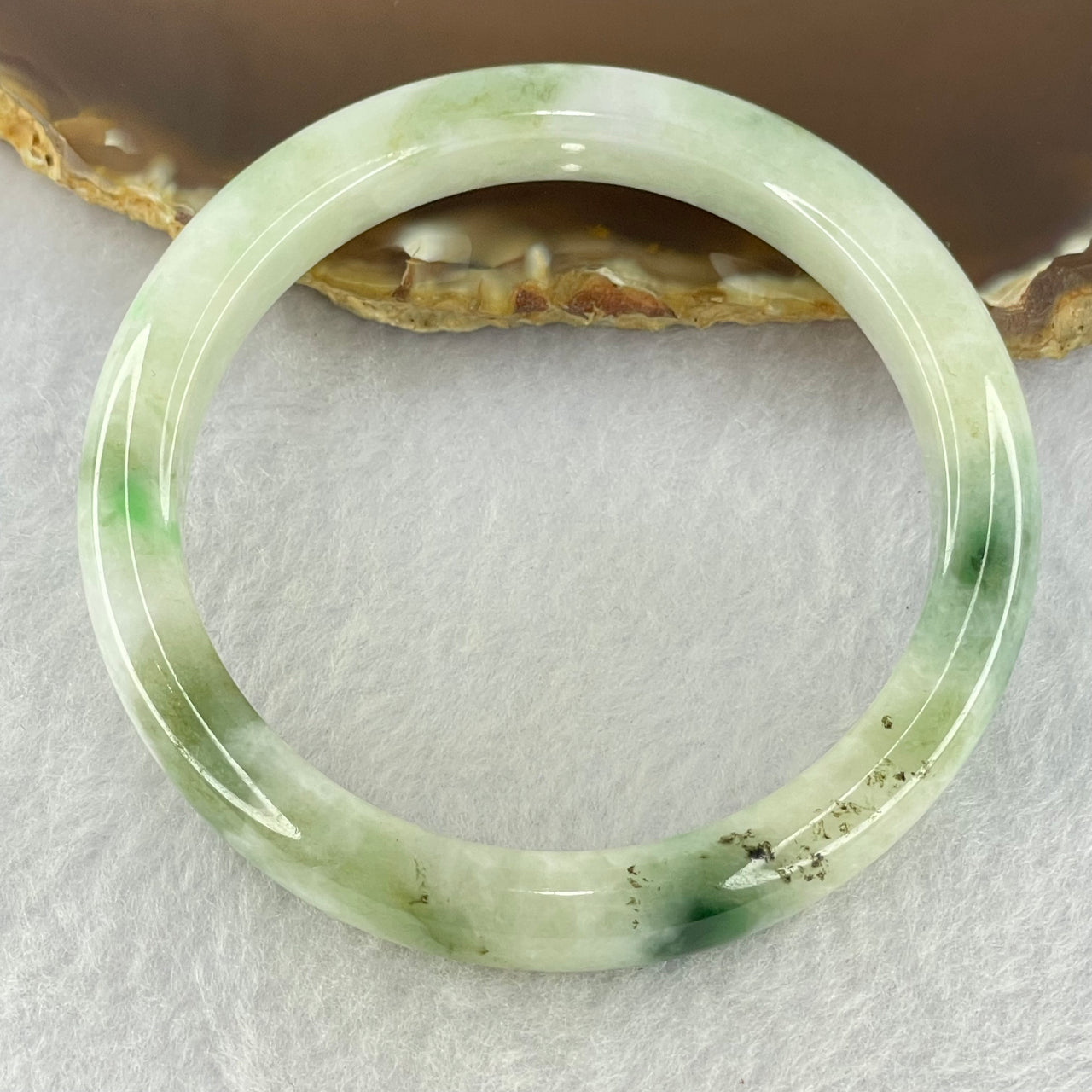 Type A Light Green with Moss Green Piao Hua Jadeite Bangle Internal Diameter 55.6mm 41.97g 10.4 by 7.6mm ( Very Slight External Rough + Internal Lines)