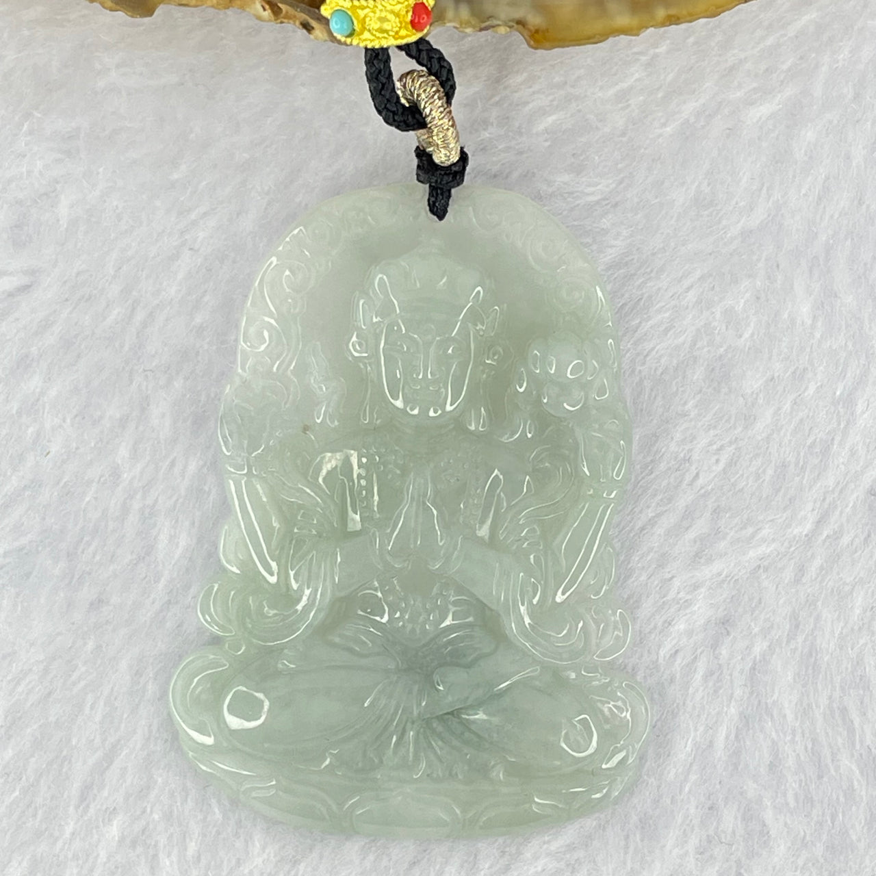 Type A Faint Green Lavender Jadeite Thousand Hand Guan Yin Pendant 18.68g 49.2 by 36.7 by 5.6mm