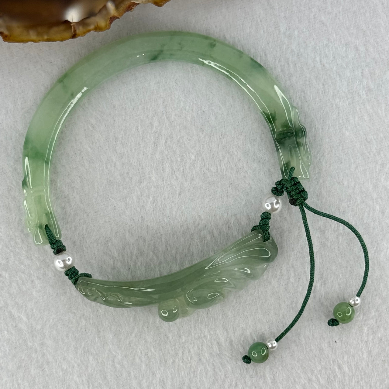 Type A Semi Icy Green with Green Piao Hua Jadeite 9 Tail Fox Bracelet 22.72g 68.6 by 4.5 by 8.1mm, 48.1 by 13.9 by 12.0mm