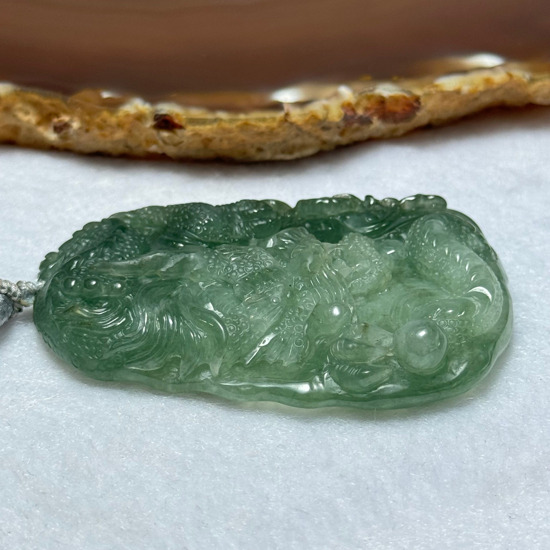 Type A Semi Icy Intense Green Jadeite Dragon Pendent 57.55g 63.1 by 44.4 by 11.3mm - Huangs Jadeite and Jewelry Pte Ltd