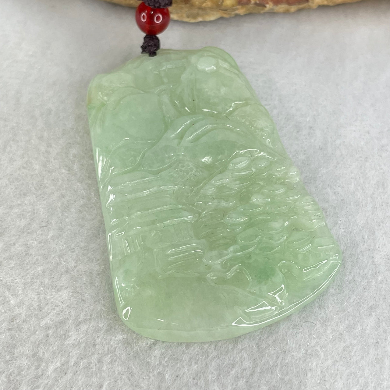 Type A Semi Icy Light Green Jadeite Shan Shui with Gui Ren Benefactor Pendant 19.35g 51.4 by 35.3 by 5.4mm