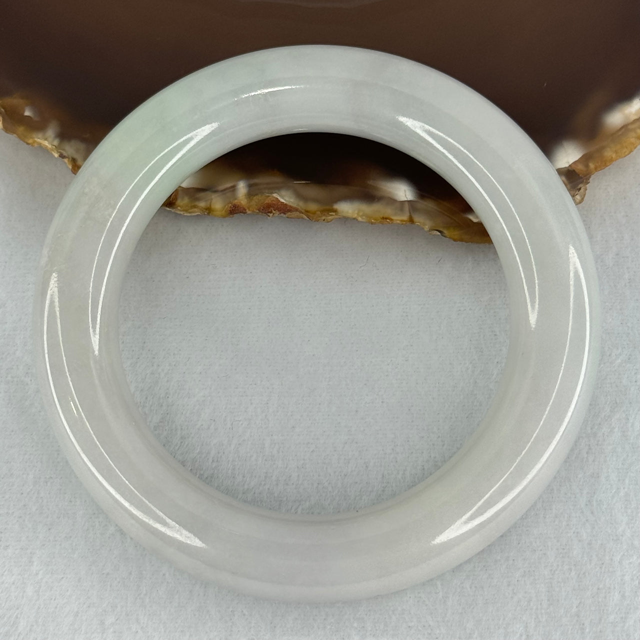 Type A Translucent Faint Blueish Green with Faint Lavender Jadeite Bangle Internal Diameter 56.79mm 437.29cts 87.85g 12.0 by 13.0mm With NGI Cert 32886087 (Close to Perfect)