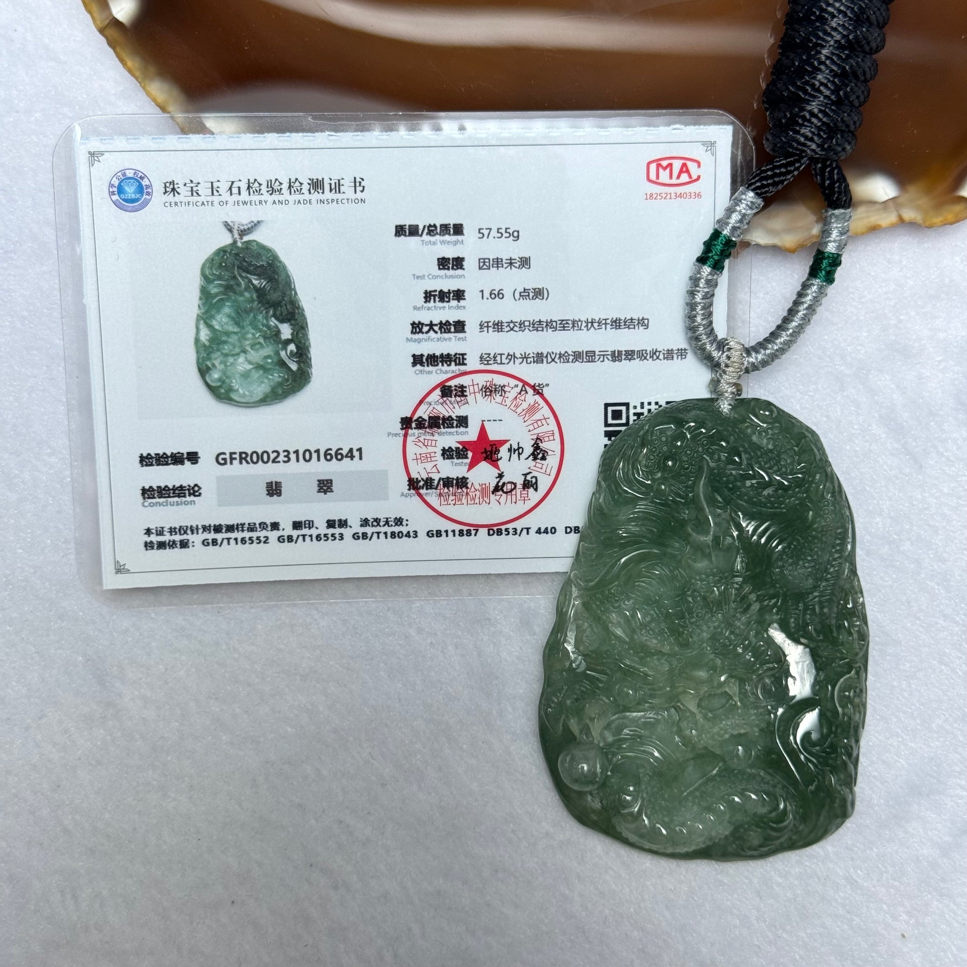 Type A Semi Icy Intense Green Jadeite Dragon Pendent 57.55g 63.1 by 44.4 by 11.3mm - Huangs Jadeite and Jewelry Pte Ltd