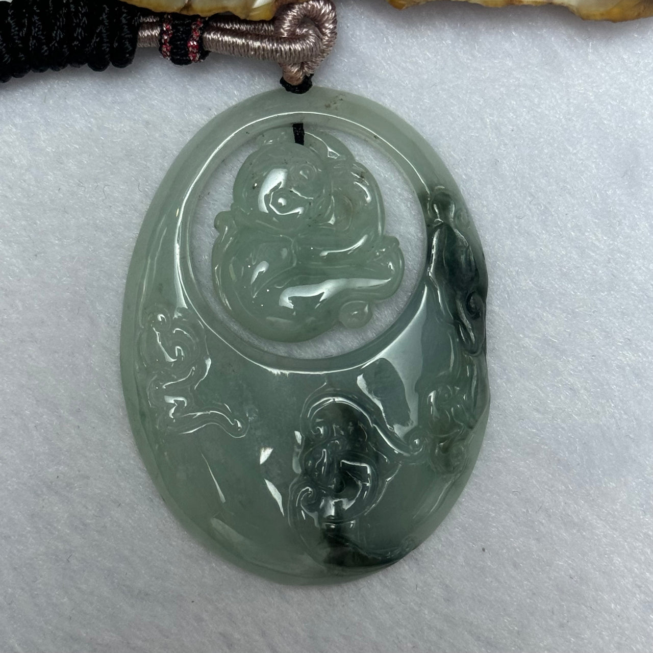 Type A Green Piao Hua Jadeite Monkey Pendent 25.79g 52.1 by 38.4 by 6.7mm - Huangs Jadeite and Jewelry Pte Ltd