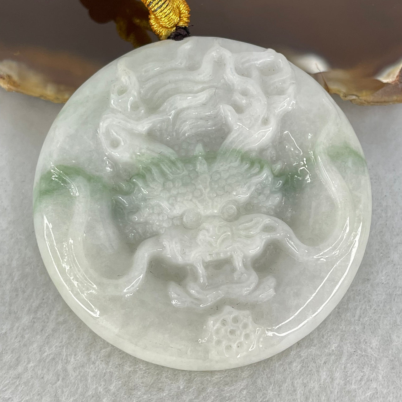 Type A Faint Lavender Green with Blueish Green Stripe Jadeite Round Dragon Pendant 45.44g 52.4 by 7.9mm