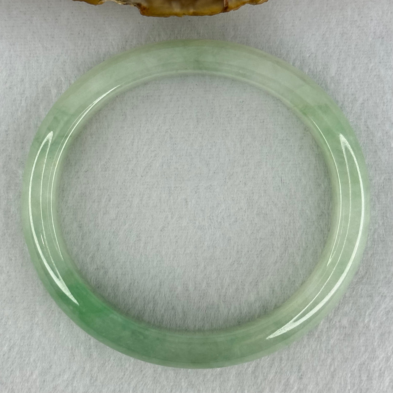 Type A Semi Icy Bright Green Jadeite Oval Bangle Internal Diameter 54.4mm 40.37g 11.3 by 8.4mm (Slight Internal Lines)