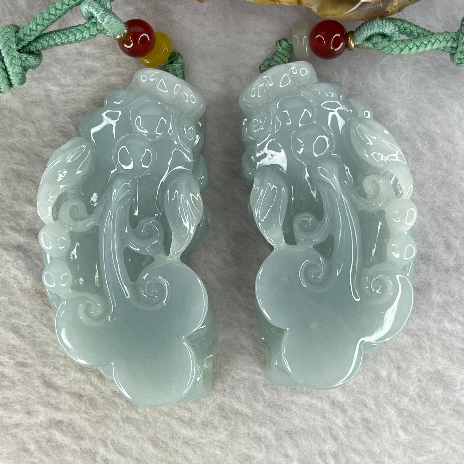 Type A Sky Blue Jadeite Pixiu Pair  40.26g 50.7 by 26.4 by 14.3 mm and 38.99g 49.7 by 25.3 by 14.2 mm - Huangs Jadeite and Jewelry Pte Ltd