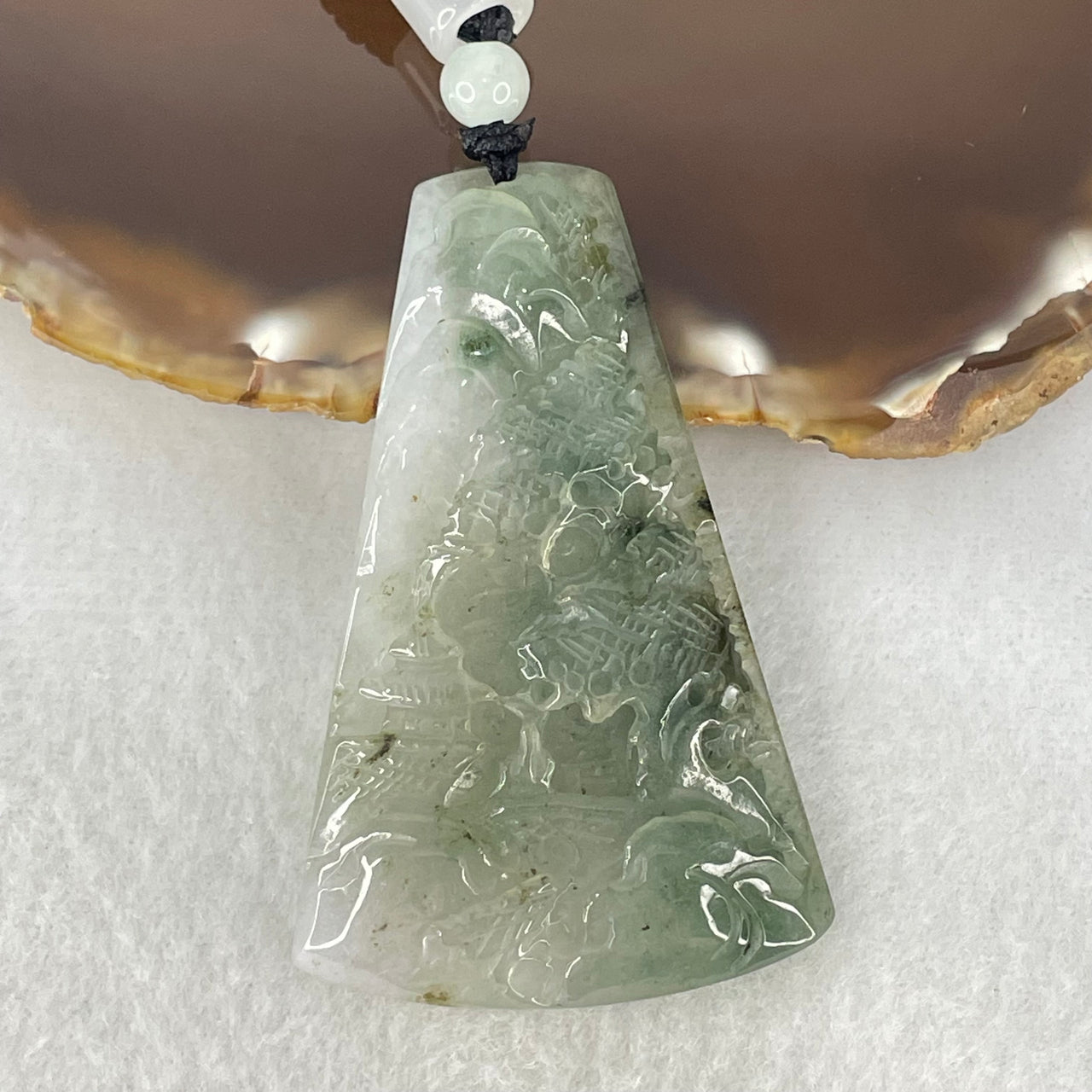 Type A Semi Icy Blueish Green Piao Hua and Faint Lavender Jadeite Shan Shui with Gui Ren Benefactor Pendant 25.20g 58.8 by 37.1 by 7.1mm