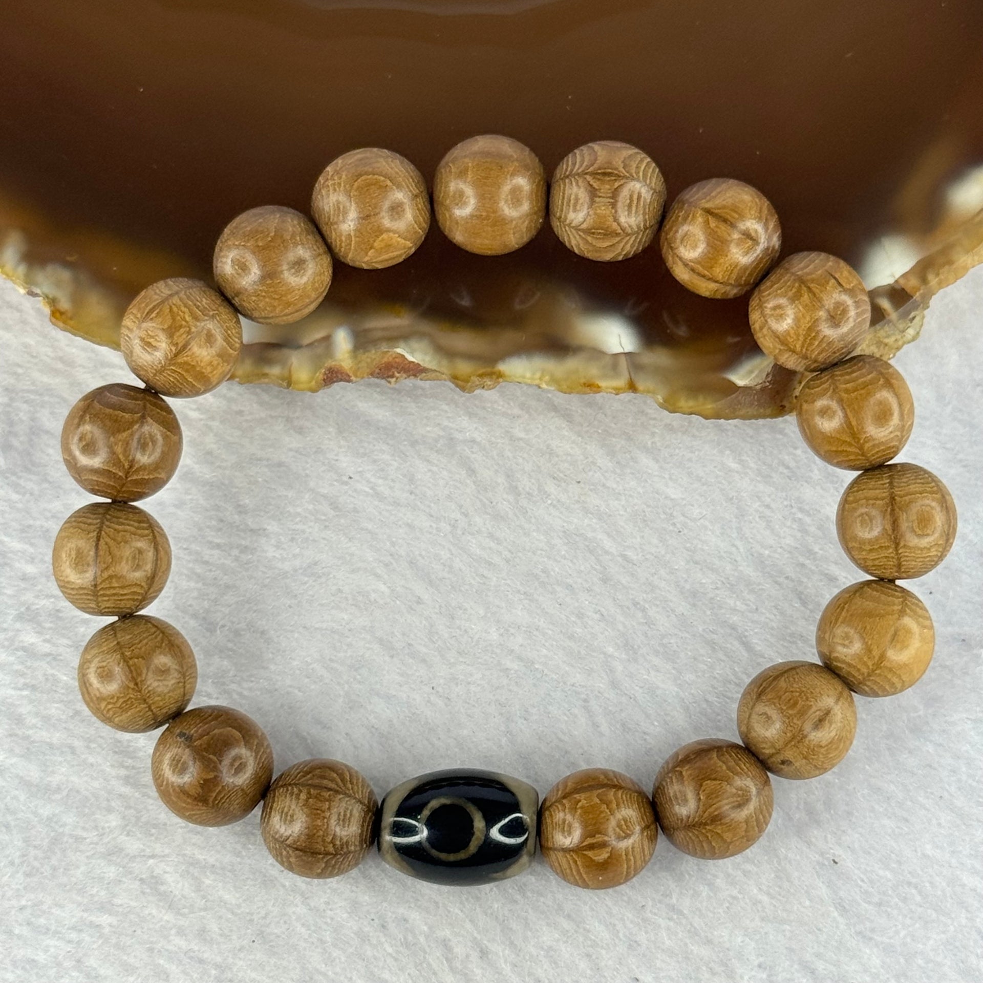 Natural Six Way Wooden Bead With 3 Eyes Dzi Bead Tian Zhu Beads Bracelets 天然六道木带三眼天珠手链 11.42g 16.5cm 10.5mm 18 Beads / 13.6 by 10.2mm 1 Bead - Huangs Jadeite and Jewelry Pte Ltd