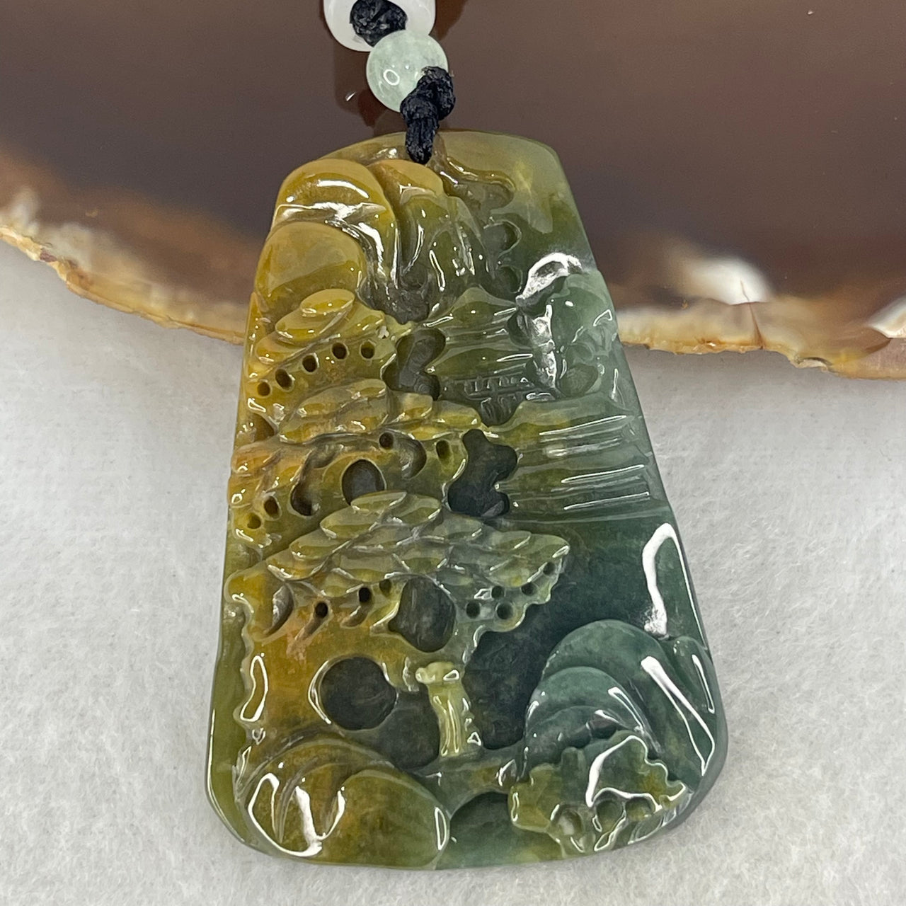 Type A Semi Icy Blueish Green with Yellowish Brown Patches Jadeite Double Sided Shan Shui with Gui Ren Benefactor Pendant 27.29g 53.7 by 37.3 by 7.5mm