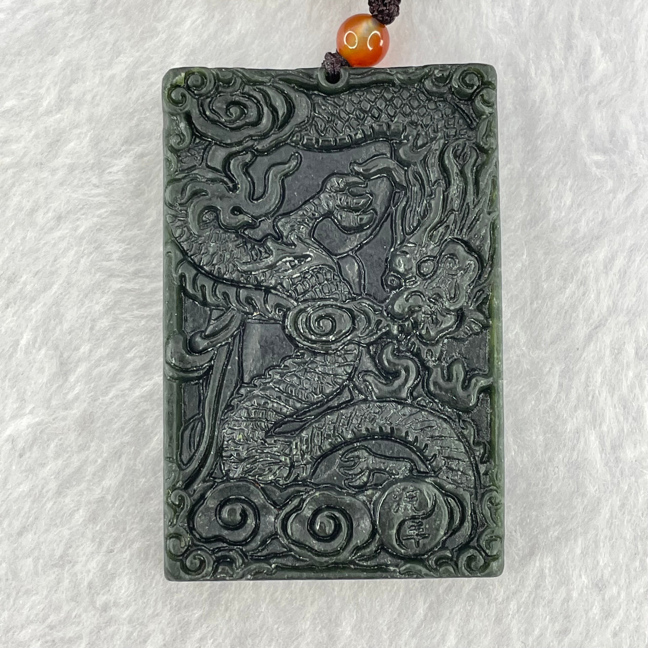 Type A Semi Translucent Dark Green Nephrite Double Sided Guan Yin With Double Dragon Pendent 46.04g 58.1 by 38.3 by 10.6mm