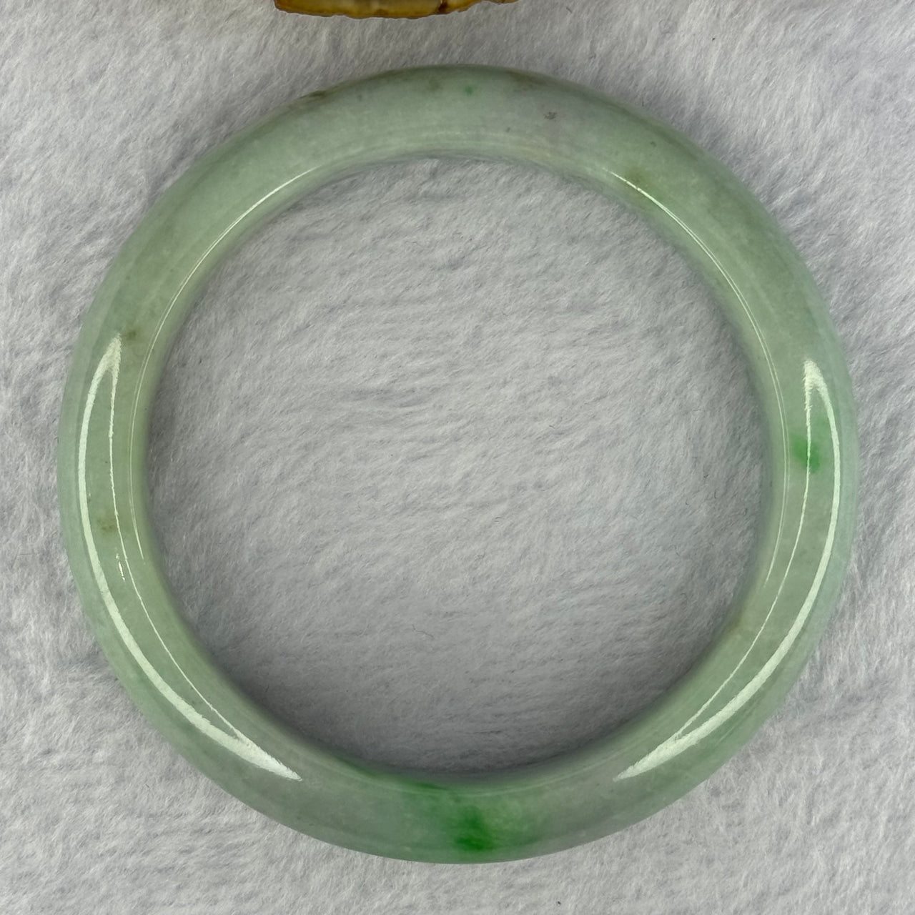 Type A Light Green with Bright Green Patches Jadeite Bangle 78.00g Internal Diameter 61.7mm 14.5 by 9.9mm (Very Slight External Rough)