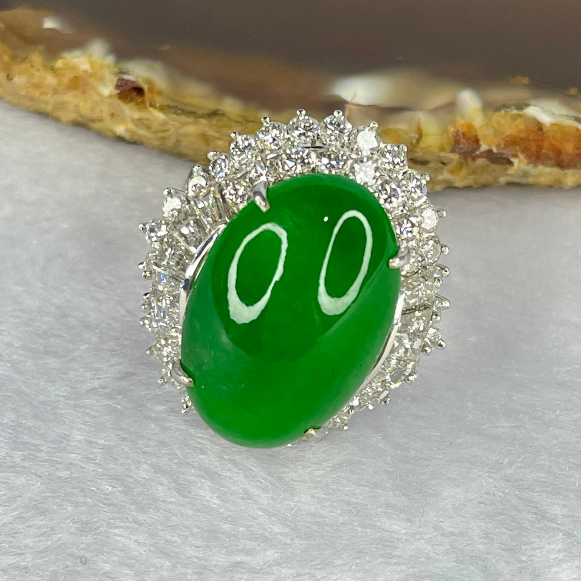 Very Very High Quality Highly Translucent Natural Intense Green Jadeite (TYPE A) Oval Cabochon Approx. 20.93 by 13.95 by 6.58mm Total Weight 13.60g including Natural Diamonds and 13K White Gold Ring Setting with NGI Cert No.82835781 - Huangs Jadeite and Jewelry Pte Ltd