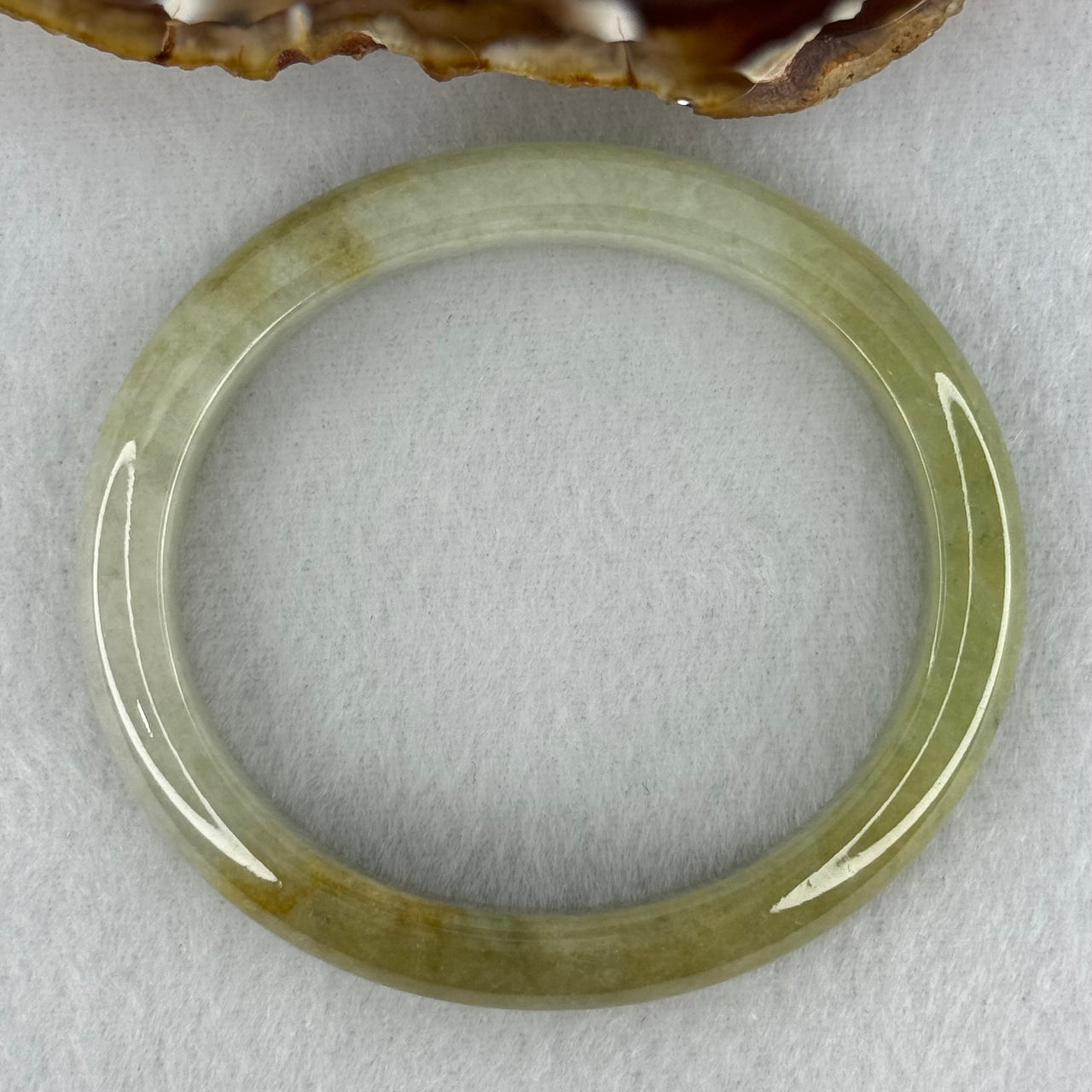 Type A Yellowish Green Lavender Jadeite Oval Bangle Internal Diameter 58.5mm 67.31g 10.7 by 8.1mm (Very Slight Fine Internal Line)