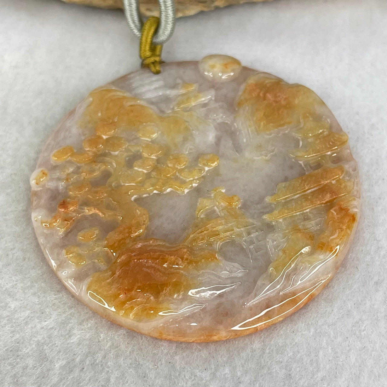 Type A Faint Lavender and Reddish Brown Jadeite Shan Shui with Gui Ren Benefactor Pendant Pendant 32.47g 51.6 by 5.6mm