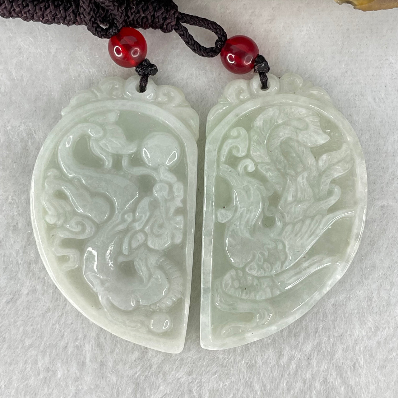 Type A Faint Green Lavender Jadeite Dragon and Phoenix Cut in Half Pendant Pair 24.12g 43.6 by 25.7 by 4.6mm