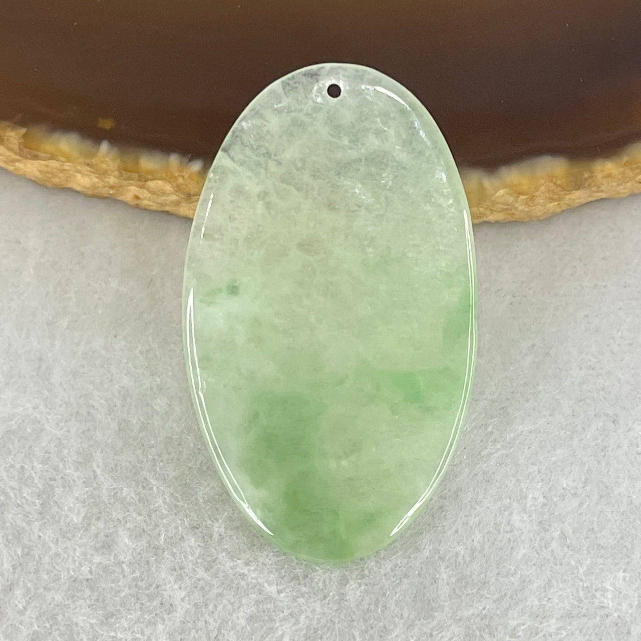 Type A Semi Icy Light Green Jadeite Oval Wu Shi Pai Pendant 2.80g 24.2 by 20.2 by 1.6mm