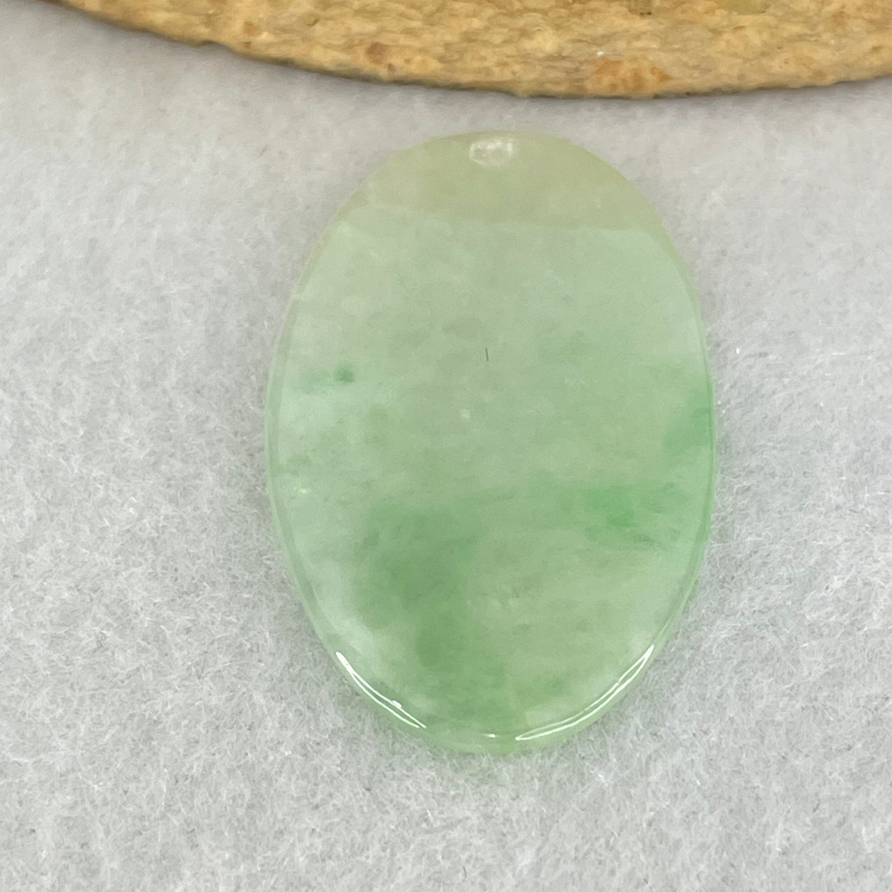 Type A Semi Icy Light Green Jadeite Oval Wu Shi Pai Pendant 2.80g 24.2 by 20.2 by 1.6mm