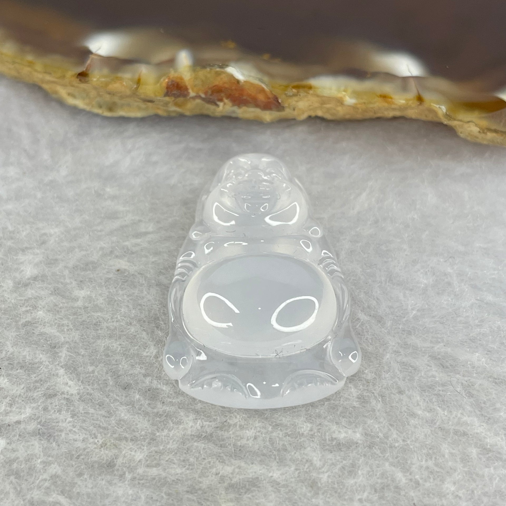 Type A Icy White Jadeite Milo Buddha 5.57g 29.7 by 19.2 by 7.2 mm - Huangs Jadeite and Jewelry Pte Ltd