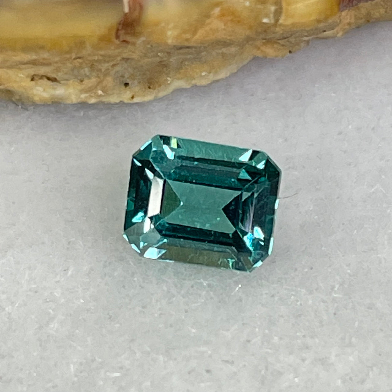 Rare Natural Greenish Blue Tourmaline Stone For Setting Cut -cornered rectangular, step cut 0.90cts 6.31 by 5.18 by 3.59mm NGI Cert No:32887345