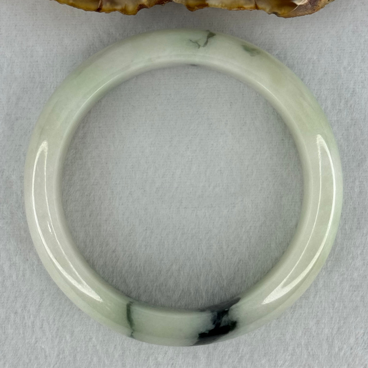 Type A Light Green with Moss Green Patches Jadeite Bangle Internal Diameter 56.5mm 75.29g 16.4 by 8.4mm (Slight Internal Line)