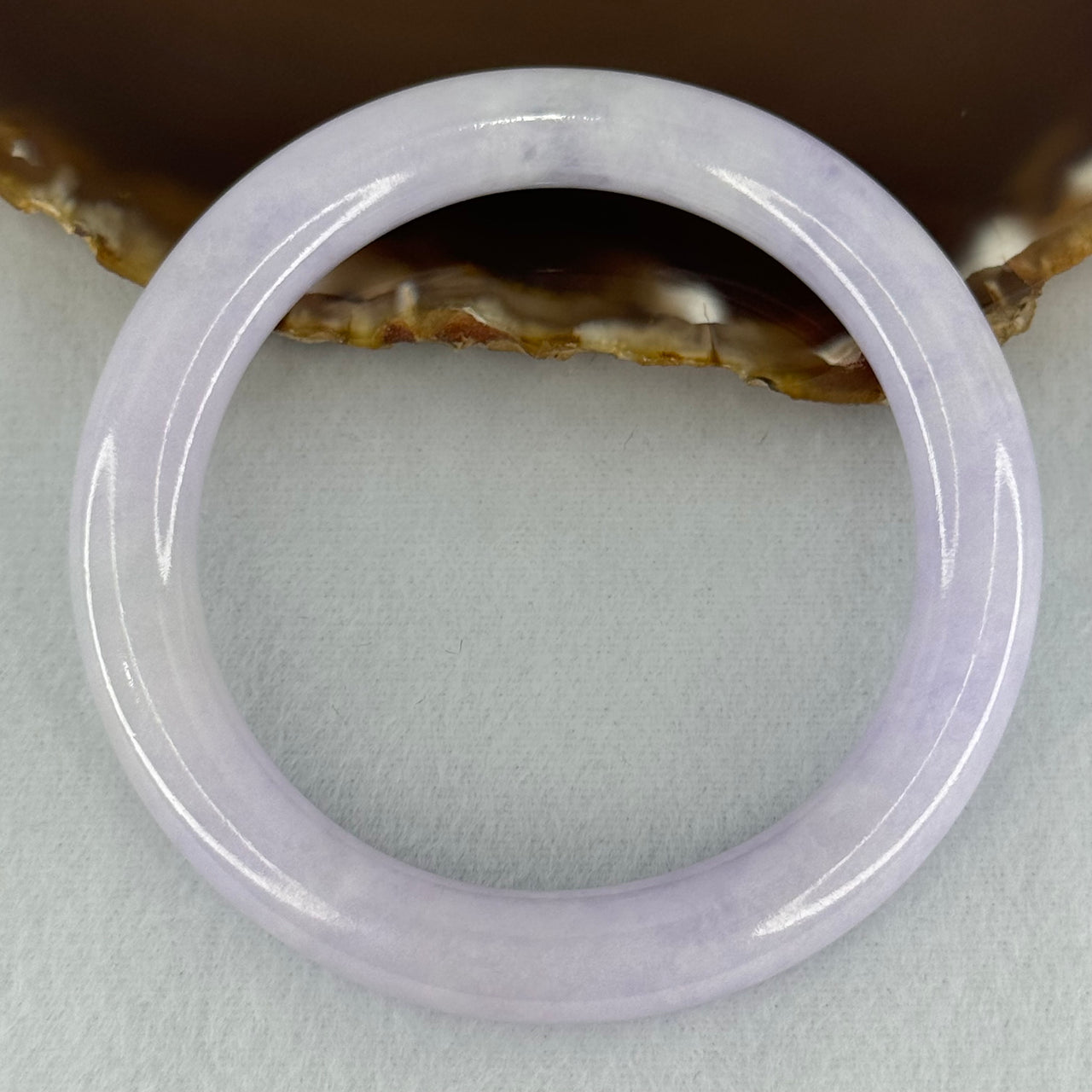 Type A Translucent Light Lavender Jadeite Bangle Internal Diameter 57.50mm 278.87cts 56.05g 10.1 by 10.5mm With NGI Cert No 32886053 (Slight External Line)